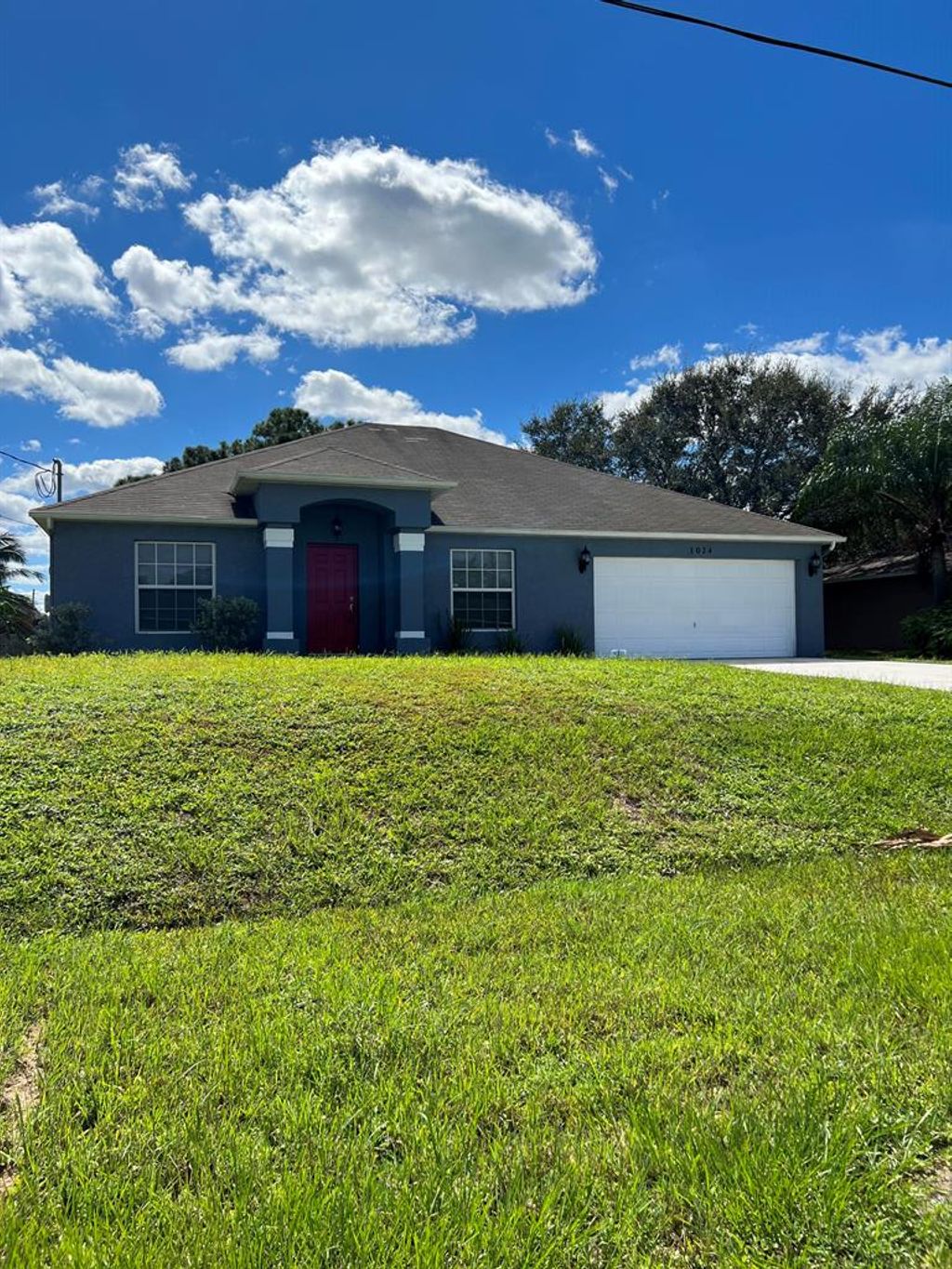 Photo of 1024 SW Estaugh Avenue, Port Saint Lucie, FL 34953 (MLS # R10837075)