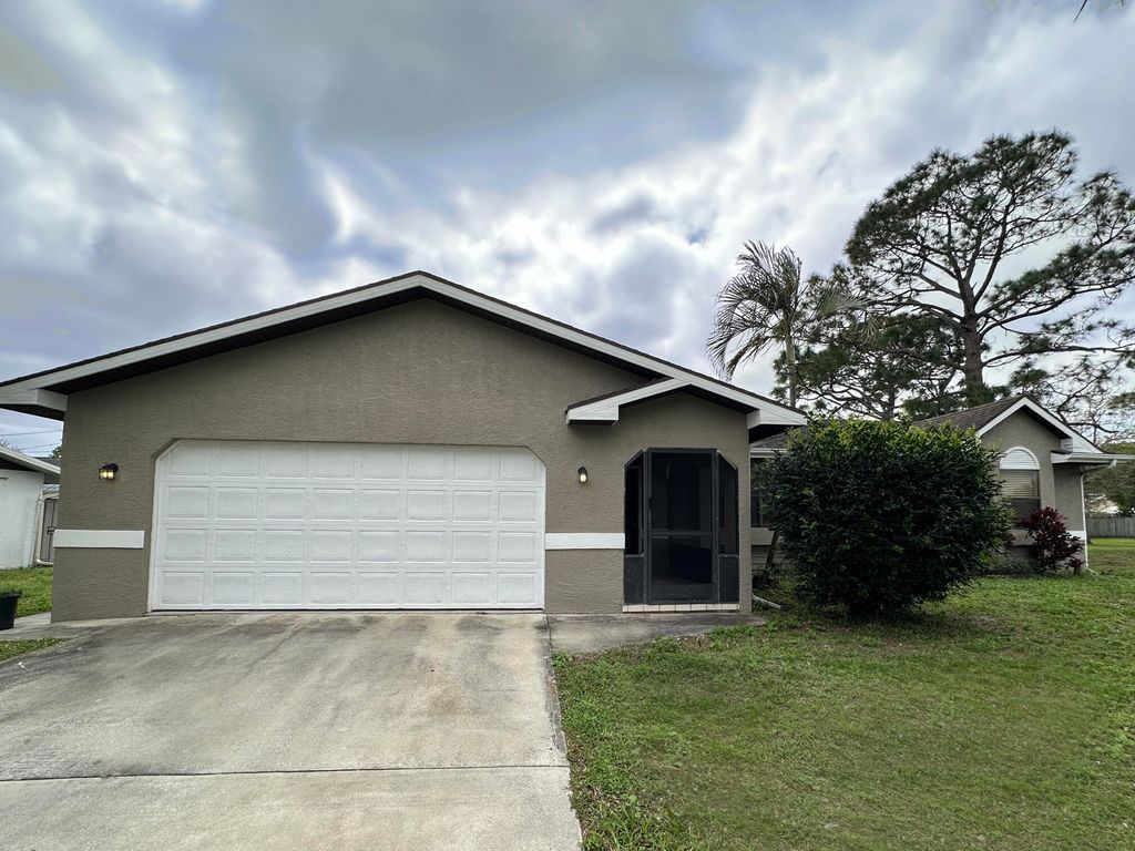 Photo of 340 NW Placid Avenue, Port Saint Lucie, FL 34983 (MLS # R11065736)