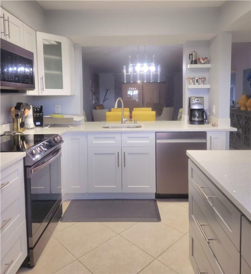 Stunning lake view from this beautiful penthouse condo, 2bedroom 2bath unit.Updated kitchen with Stainless steel appliances and quartz counter tops.  Freshly painted in neutral color to compliment any designer taste.  New A/C unit. Master bedroom has sitting area & 2 walk-in closets. Enjoy the convenience of a laundry room inside your unit with a brand-new full-size washer & dryer. Extra storage room outside unit.   Huntington Lakes is an active community offering many amenities including an indoor & Outdoor pool, Sauna, whirlpool, tennis, pickleball, billiards, theater, shows, club library, courtesy bus to local shopping & dining and so much more! Your search stops here!! Call for appt today.