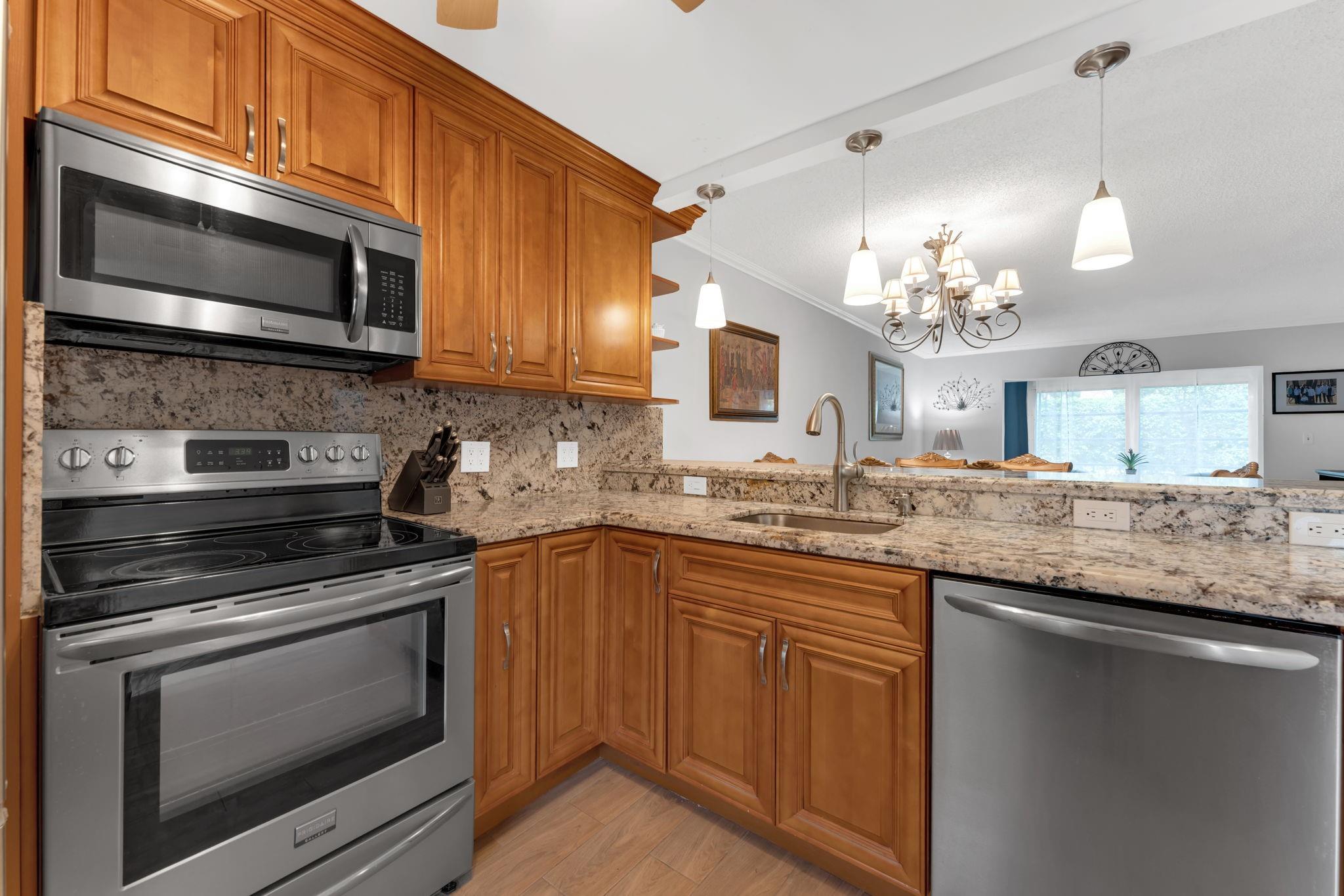 Beautifully Updated 1st Floor Unit A Must See. Quiet and Desirable 55+ Community/Oriole Gardens III. Enjoy many Social Events and make new Friends. Boasting with Pride of Ownership and many Amazing Upgrades. Gorgeous Updated Kitchen Classic Wood Cabinets, Granite Countertops/Back Splash and Pendant Lighting. Bathrooms are Beautifully Updated Both with Walk-in Showers and All New Tile from Floor to Ceiling. New Interior Doors and hardware, Crown Molding and Tile Floors through the Main Living area with Wood Tone Laminate Floors in the Bedrooms. Upgraded Light Fixtures and Ceiling Fans, Enclosed Florida room that is Opened to the Main Living area to Extend the Living Space. A/C 2023, HWH 2015. Strong Community, Association Requires 700+ CS $40K+ Income NO Assessments NO Renting