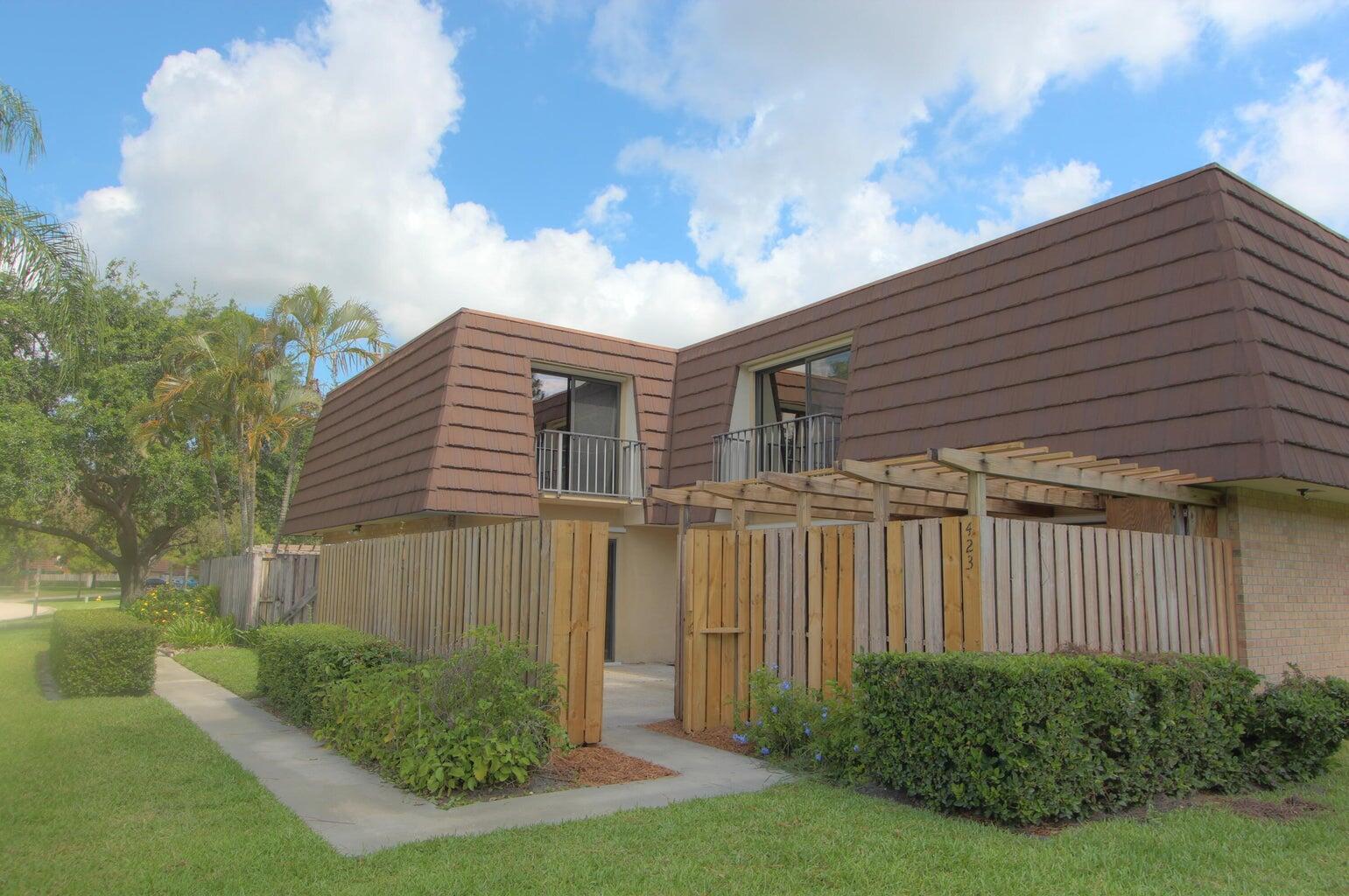 Highly sought-after recently painted Garden Lakes 3BR/2.5BA courtyard-style townhome! Spacious 2-story layout features updated kitchen with breakfast bar, dining area, living room, and downstairs bedroom with half bath. Upstairs offers an ensuite master, additional bedroom, full bath and faux wood tile flooring thru out. Enjoy a large private fenced patio with storage shed. Rental requirements: first, last, security, cleaning fee, non-refundable pet deposit (if applicable), and proof of income.