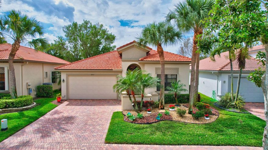 This beautiful lake view home will take your breath away. With magnificent 12 ft. ceilings and crown molding throughout, this popular Chardonnay model, with 2.5 baths, provides an open floor plan perfect for entertaining friends and family.
Enjoy the fully renovated white kitchen with waterfall Quartzite countertops, custom pullout drawers, and plenty of storage.  The stainless-steel appliance package includes a new BOSCH French door refrigerator and a BOSCH dishwasher. 
The primary bedroom suite is large enough to fit any size bedroom set with a sitting area, stunning lake views, two custom fitted walk-in closets, a large safe for valuables, and a linen closet. Its bathroom has two separate vanities with granite countertops, floor to ceiling mirrors, walk-in shower, and separate tub. The second bedroom is large enough for a Queen size bed and complete bedroom set. Its custom closet is fitted with plenty of drawers and hanging space.  The second full bath includes granite counter tops and decorative tile shower with a second linen closet in the hall.
Double privacy doors on the third bedroom provide options to use it as a bright office/den with its large window and white built in cabinets or add a closet or armoire use it as another guest room. 
The open living area has space for a formal dining room table as well as a kitchen table and a built-in wall unit.  Open the triple sliding doors to step onto the expansive screened-in lanai with gorgeous views of the lake.
Other notable features include the laundry room with a large capacity washer and dryer and built-in cabinets, a custom garage floor set up for easier two car parking. The air conditioning, installed in 2018, was recently upgraded with clean air purifying ultraviolet lights.  A new 50-gallon water heater was installed in 2022. 
This home's brick paver driveway and walkway match Four Seasons at Delray Beach's unique brick paved sidewalks and tree lined streets.  A boutique community with a newly renovated clubhouse, Four Seasons at Delray Beach offers amenities and activities for everyone. Sports include tennis and pickleball at all levels from beginner to competitive league teams.  Residents also enjoy ping pong, water volleyball, Newcomb, and aqua fitness.  The state-of-the-art fitness center offers group classes, personal training, massage and physical therapy.  Residents can be as busy or quiet as they like, choosing from a variety of popular social and philanthropic clubs including a karaoke club, book club, wine club, bridge club, computer and technology club, women's and men's clubs, and PAPS Corps chapter.  Enjoy concerts and entertainers in the luxurious ballroom with its stage and dance floor. Relax in the community gathering room with its cozy electric fireplace. Join a game of mahjongg, canasta, bridge or poker in one of the 3 spacious card rooms. The onsite Social Director plans activities including BBQ's, holiday events and card parties, movie and game nights. The Four Seasons Community is located close to Delray Marketplace's restaurants, bowling and movie theater, and popular downtown Delray.  Find everything you are looking for at an affordable price in Four Seasons. Don't miss the rare opportunity to see this beautiful, meticulously cared for home and its spectacular views. This home can be sold unfurnished or furnished with select exclusions.