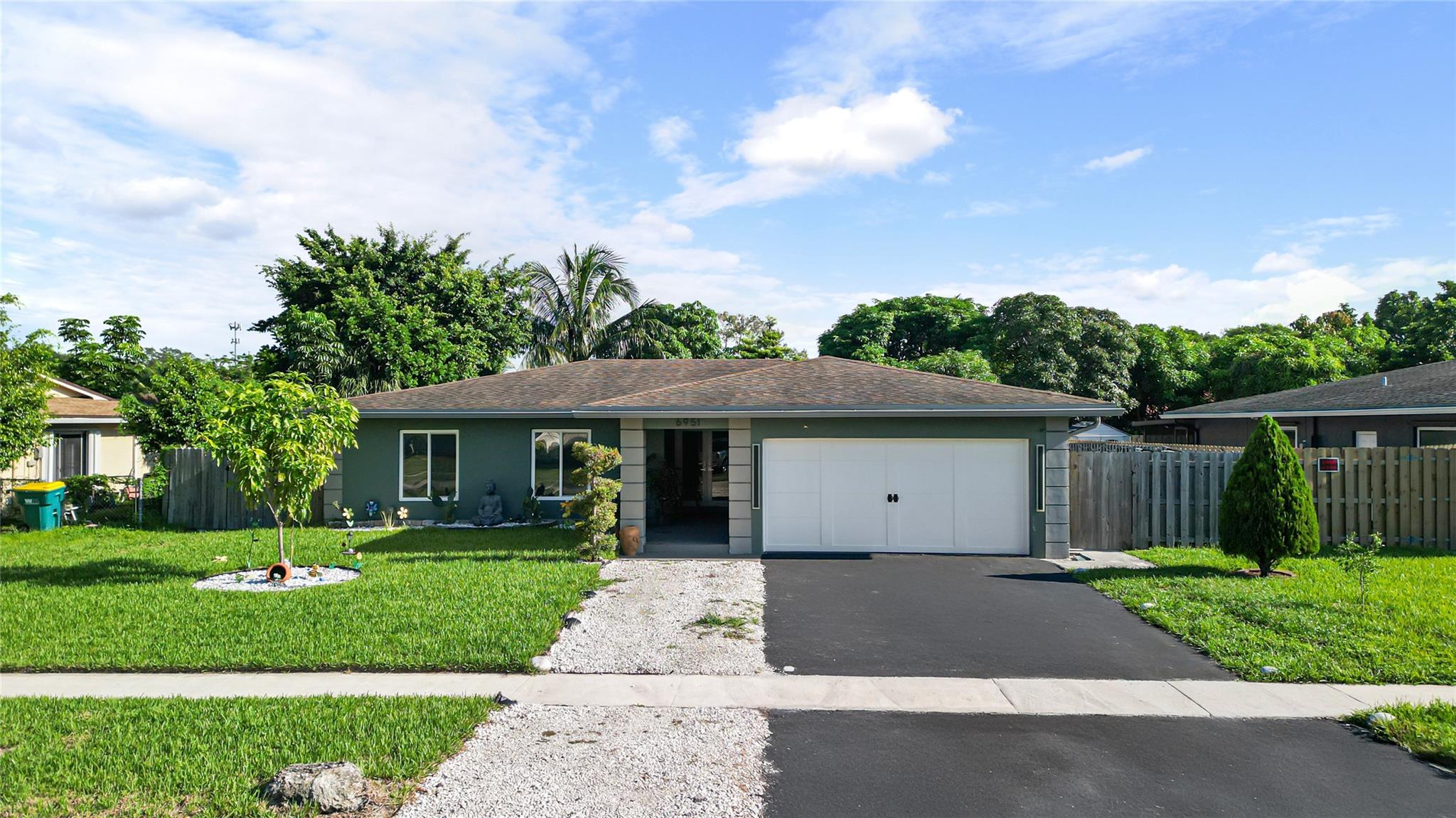 Beautifully renovated home with modern upgrades and impact features. Welcome to this stunning home featuring a perfect blend of comfort and modern finishes. The property offers peace of mind with impact windows and all doors, a newer AC (5 years old), a tankless water heater, and a newer electrical panel.
Inside, enjoy a bright and open layout with a large quartz island, new washer and dryer, a 4-year-old oven, cooktop stove, dishwasher, and electric blinds. The master bathroom has been fully renovated and includes a spacious walk-in closet. The home boasts shiny tile floors (installed 5 years ago) throughout.