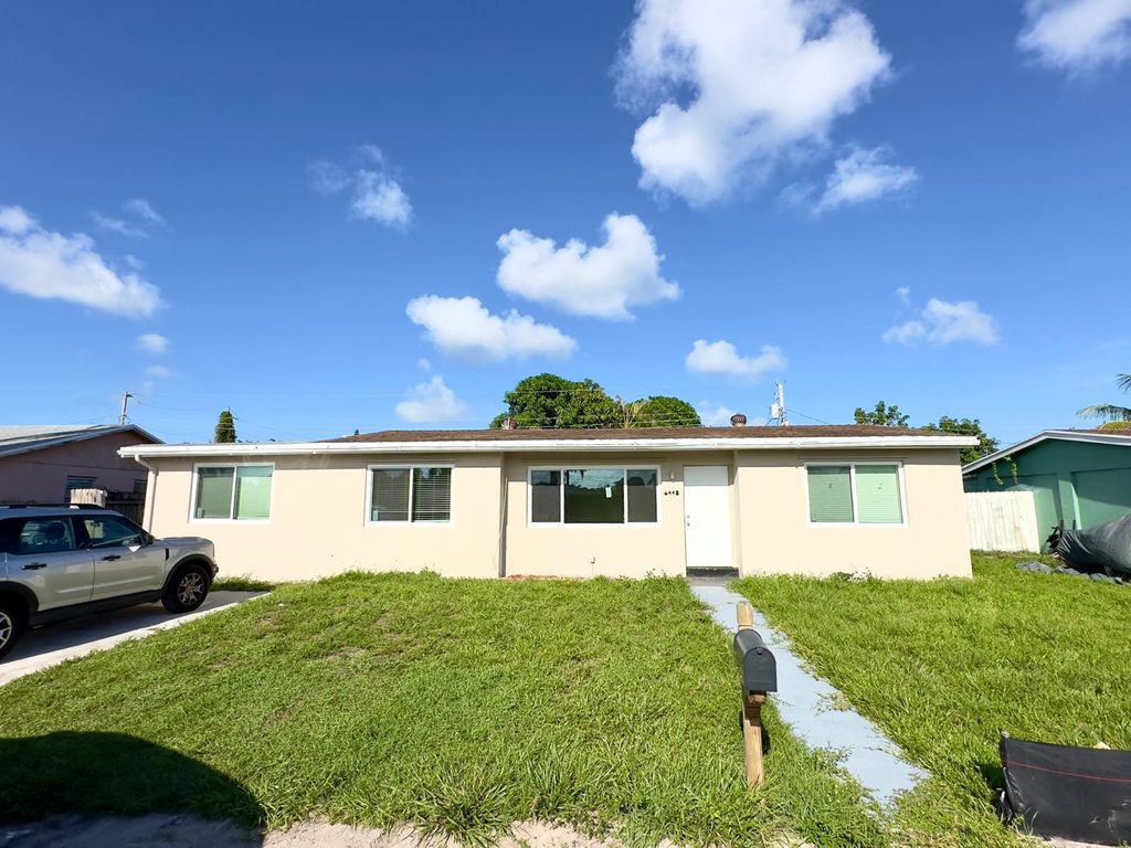 Photo of 6448 Lawrence Road, Lake Worth, FL 33462 (MLS # R10999127)