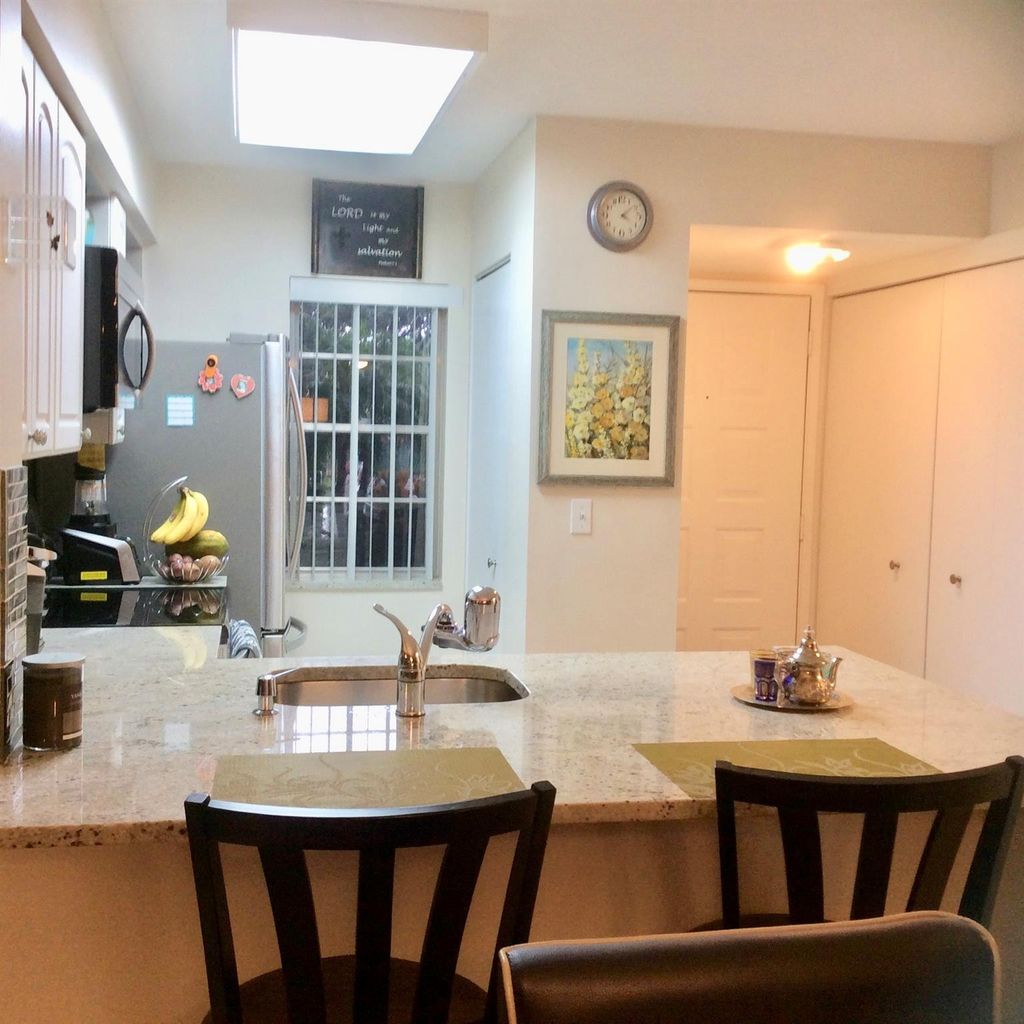 Photo of 2220 N Cypress Bend Drive #104, Pompano Beach, FL 33069 (MLS # B26033931)
