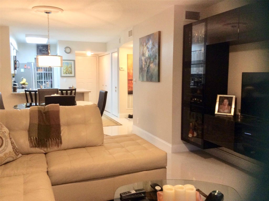 Photo of 2220 N Cypress Bend Drive #104, Pompano Beach, FL 33069 (MLS # B26033931)