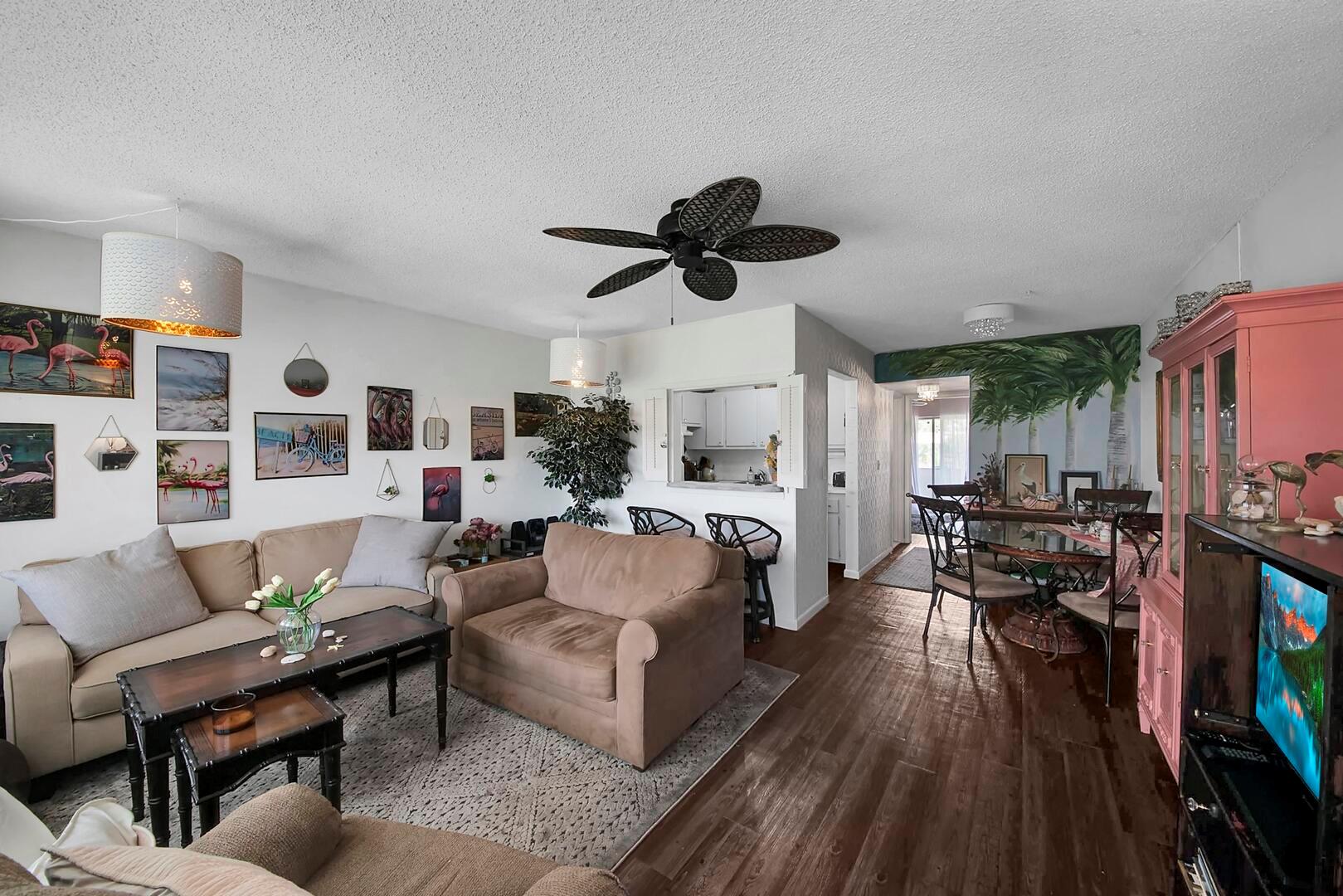 Welcome to this beautifully furnished 1 bedroom, 1 bath condo located on the 2nd floor in the desirable 55+ community of Century Village. This light-filled home features neutral flooring and an open floorplan that enhances the spacious feel. The updated kitchen offers a snack bar and plenty of cabinetry, ideal for both everyday living and entertaining. The primary suite includes a large closet and a sliding glass door that opens to a screen-enclosed balcony with tranquil canal views--perfect for relaxing. Additional highlights include a new roof (2023) and a serene setting. Enjoy the exceptional amenities and lifestyle that Century Village has to offer!
