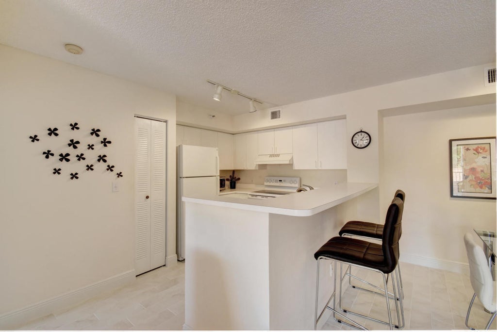 Photo of 135 Yacht Club Way #207, Hypoluxo, FL 33462 (MLS # B26075998)