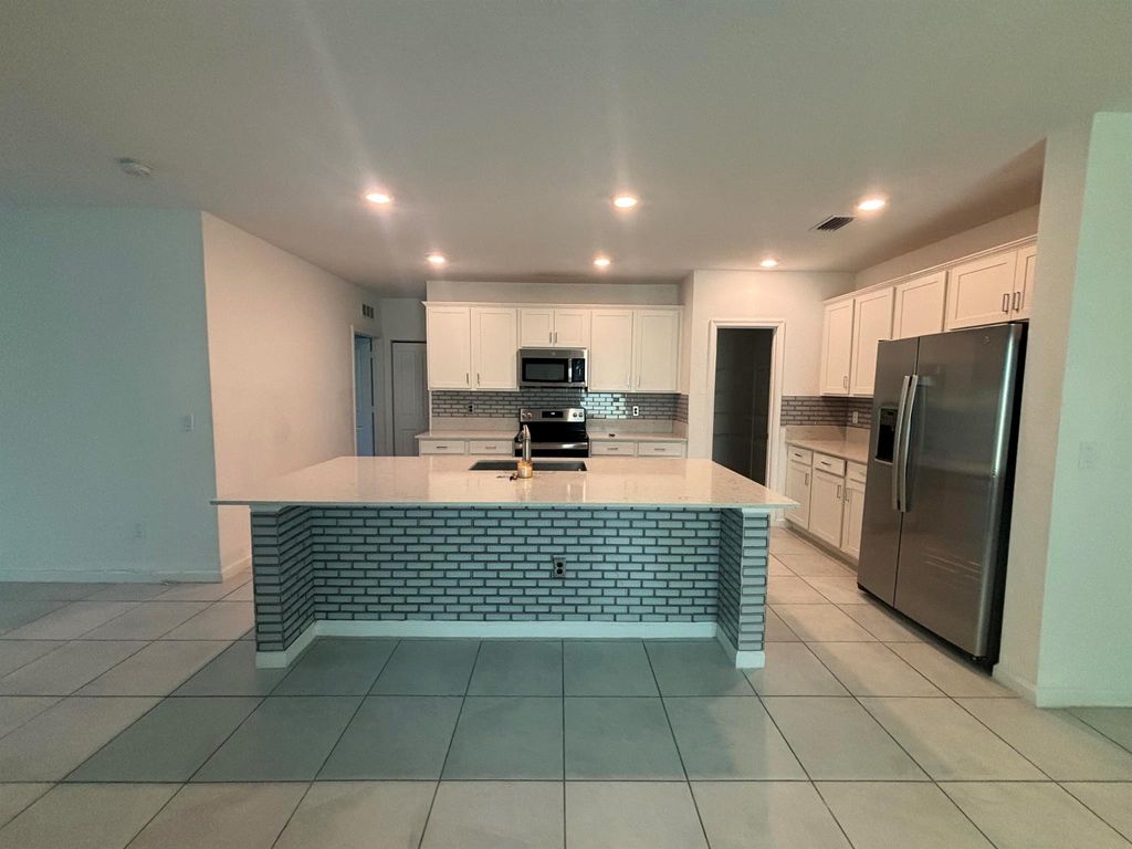 Photo of 740 Worlington Ln, Fort Pierce, FL 34947 (MLS # R11116218)