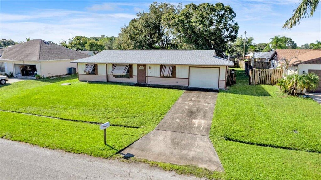 Photo of 412 SE Dalva Avenue, Port Saint Lucie, FL 34984 (MLS # B26076860)