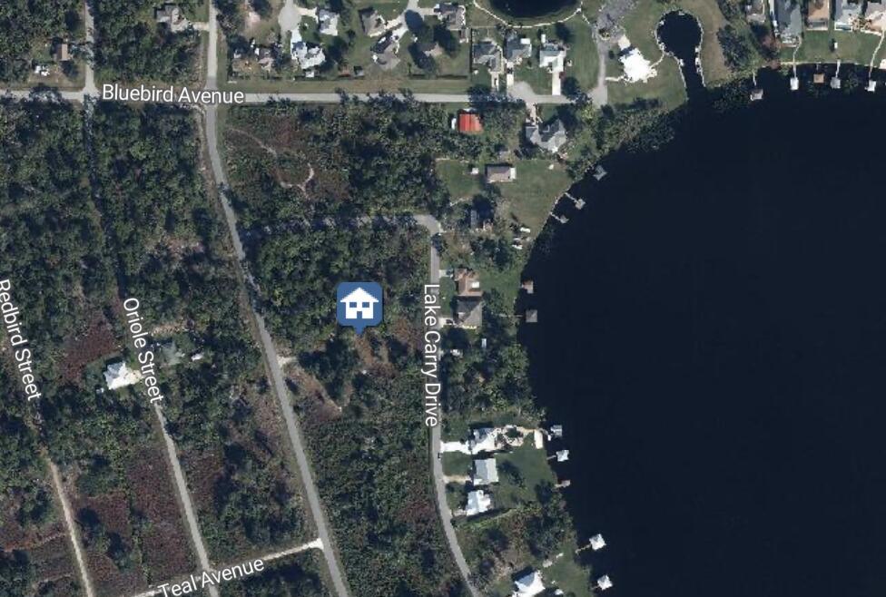 Priced to sell. Build your dream home on a quarter acre pie shaped lot, one block from the lake or hold this lot to build in the future. This residential vacant land is tucked away in a quiet neighborhood surrounding a lake where all the home around the lake have been built already.