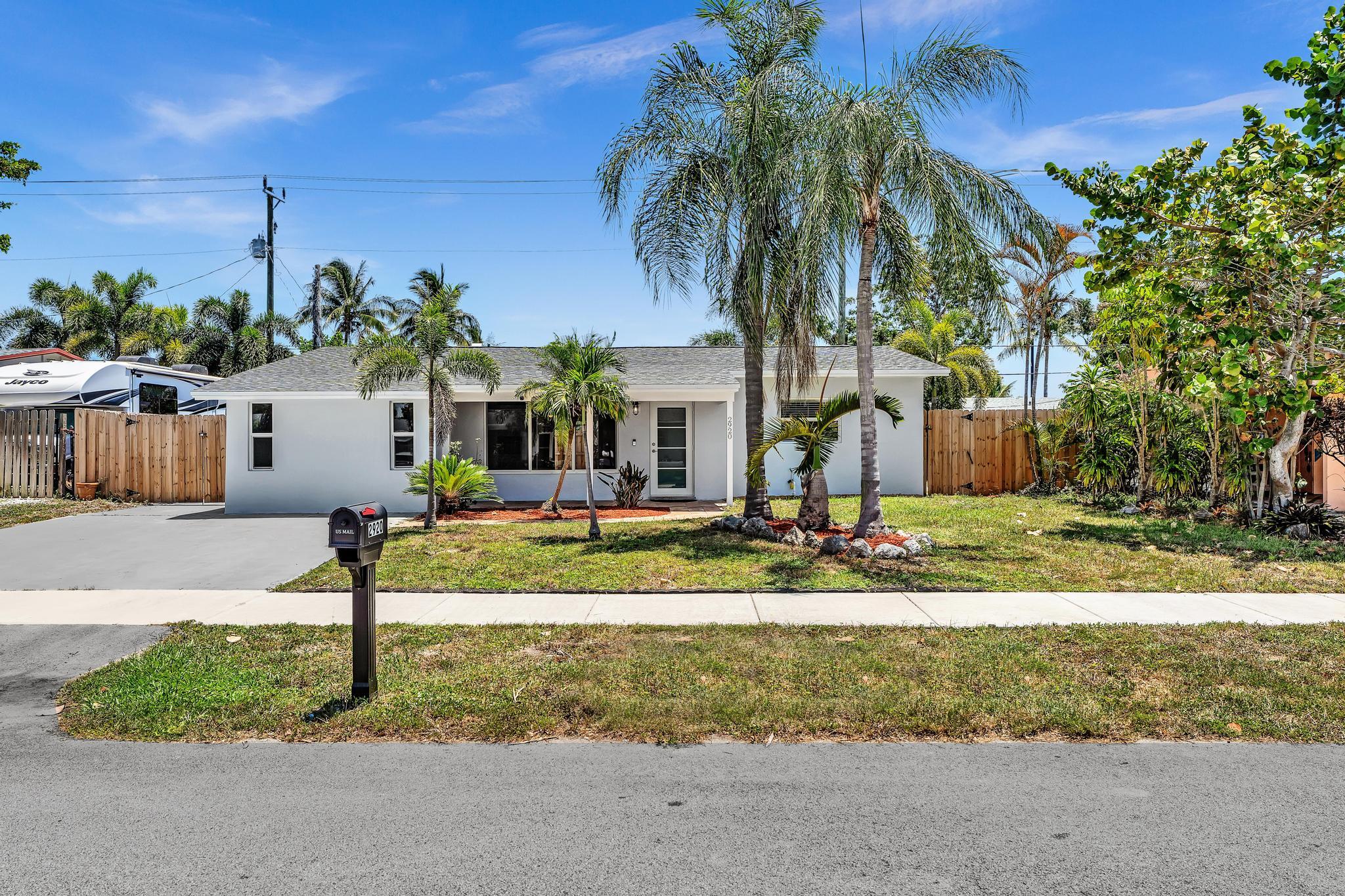 With smart, modern updates and Florida-style indoor outdoor living, this refreshed 3-bedroom, 1-bath ranch delivers on both comfort and value. Nestled in the Cresthaven neighborhood of Pompano Beach this immaculate 1,388 sq ft home boasts a bright, open design where the living, dining and kitchen areas converge into one inviting gathering space. Thoughtfully laid out with a split bedroom plan, the primary bedroom offers privacy from the two guest bedrooms perfect for families, guests or both. Extensive renovations include Hurricane impact windows and doors for peace of mind and efficiency, a new roof and HVAC system to keep you cool, stylish new kitchen featuring quartz counters, soft-close cabinetry, and graphite GE appliances ready for modern daily life, and sleek vinyl pla