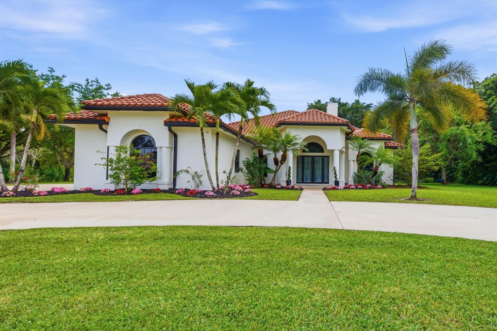 Photo of 8717 ESTATE Drive, West Palm Beach, FL 33411 (MLS # B26070141)