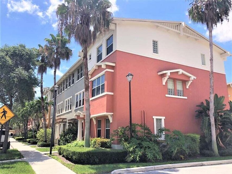 Bright & Spacious Corner Unit! This 4br / 3.5ba townhome with attached 2 car garage features 9ft ceilings and plenty of natural light, giving this home an open feel. Newer plank flooring, ceiling fans, light fixtures and window treatments. Freshly painted in warm neutral tones throughout. Kitchen features granite counters, pull-down faucet, 42'' cabinets & stainless steel appliances. Oversized washer & dryer in laundry room. Perfectly situated 5 minutes from downtown, PBI airport, and I-95. Shop and dine across the street at the outlet shops & Whole Foods. Community features 24hr manned gate w/ nightly roving patrol, clubhouse, gym, jogging path, and HUGE lakeside pool w/ covered BBQ area. Rent includes water, sewer, trash pickup, cable & high speed Wi-Fi. Move-in ready.