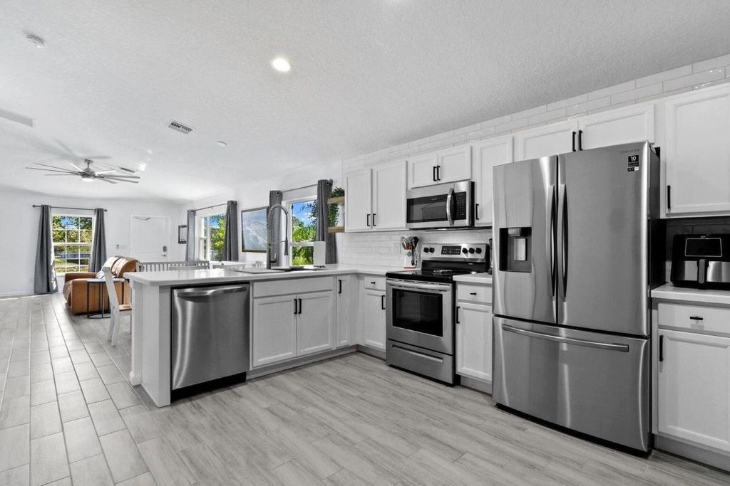 Photo of 5032 SE Flounder Avenue, Stuart, FL 34997 (MLS # R10996774)