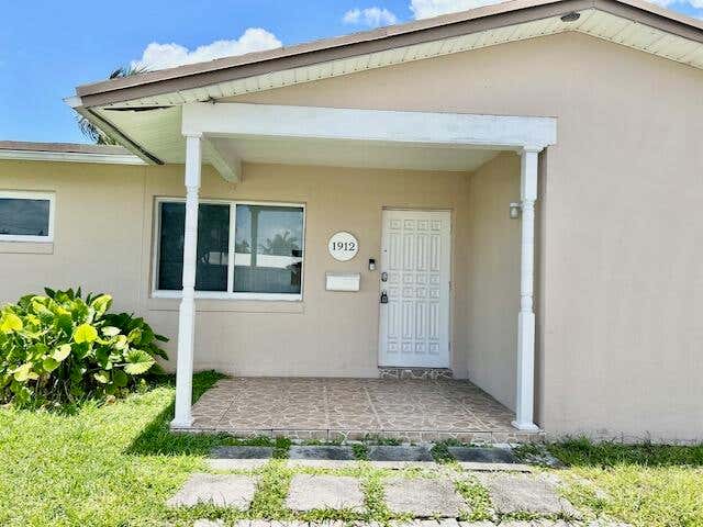 Photo of 1912 NW 38th Street, Oakland Park, FL 33309 (MLS # B26038530)
