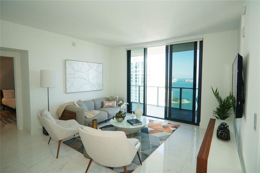 Live the ultimate Brickell lifestyle in this fully furnished 2-bed/3-bath on the 40th floor of 1010 Brickell—a 50-story icon steps from Mary Brickell Village and Brickell City Centre. Move-in ready with sweeping Bay and skyline views. Amenities are unmatched: indoor & outdoor pools, rooftop infinity pool with glass-enclosed Jacuzzi, spa with hamam & hydrotherapy plunge, fitness & yoga rooms, full squash court, outdoor cushioned track, miniature golf, “The Courts” for basketball/volleyball/mini-soccer, kids’ gym, bowling & arcade, playgrounds, adult social club, business center, movie theater, covered bar/TV lounges, self-service BBQs, and menu service to “The Club at 1010” and apartments.