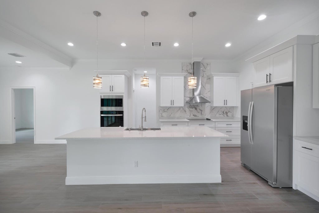 Photo of 1625 SW Chicory Terrace, Port Saint Lucie, FL 34953 (MLS # R11000547)