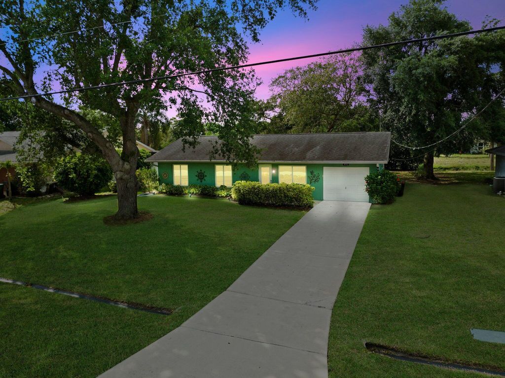 Photo of 422 SW Sansom Lane, Port Saint Lucie, FL 34953 (MLS # R10973187)