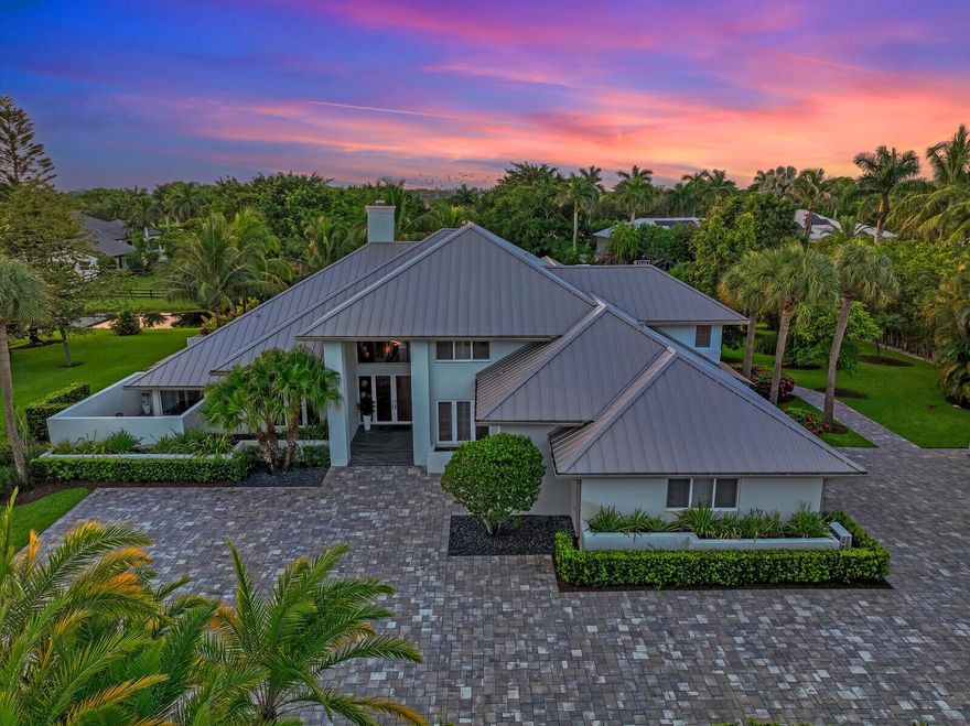 Modern custom home completely rebuilt from the studs between 2017-2019 (2018 ROOF), & more remodeling from 2021-2023 with top-of-the-line finishes & materials throughout the entire home. Situated on nearly an acre, this secluded home offers 5 bedrooms, 6.5 bathrooms & an office. The grand foyer, living areas, kitchen, master & office offer soaring ceilings with natural light via the impact solar-tinted windows. Perfect for entertaining, the custom kitchen has SS wolf & Miele appliances, and subzero refrigerator, The substantial quartz island is excellent for hosting parties with plenty of seating. There are 2 sinks, tons of prep areas & a large breakfast nook that may be your favorite place to enjoy a cup of coffee. A custom lit wet bar overlooks the living room. more...