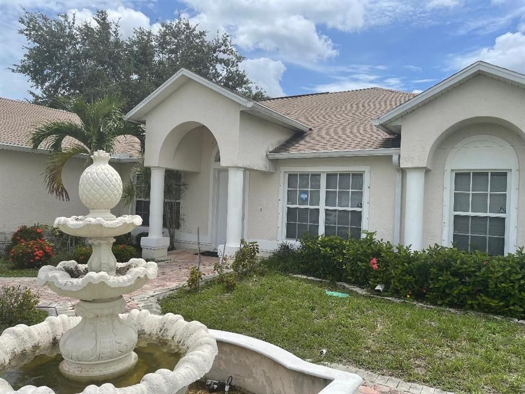 Photo of 997 SW Curtis Street, Port Saint Lucie, FL 34983 (MLS # R10728127)