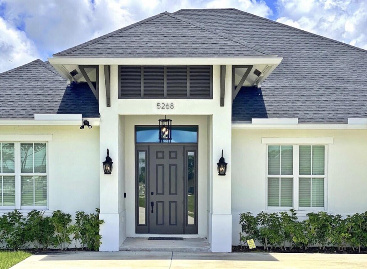 Built in 2019. 4 Bedrooms - 3 Bathrooms - 2 Car Garage and 1 Storage (Golf cart, ATV) Garage. Step inside and enjoy the light and bright interiors with spacious and open living areas, high ceilings and laminate flooring in every room. The home features shaker style solid wood cabinetry, stainless steel appliances, large island, impact windows and doors. The master suite is complete with a luxurious master bath which boasts a spa-like tub, separate shower and walk-in closet. Located next to Winterlakes Park and close to plenty of shopping, dining, Clover Park and easy access to i95. There is a lot of room to roam on this property. Move-in ready! No HOA