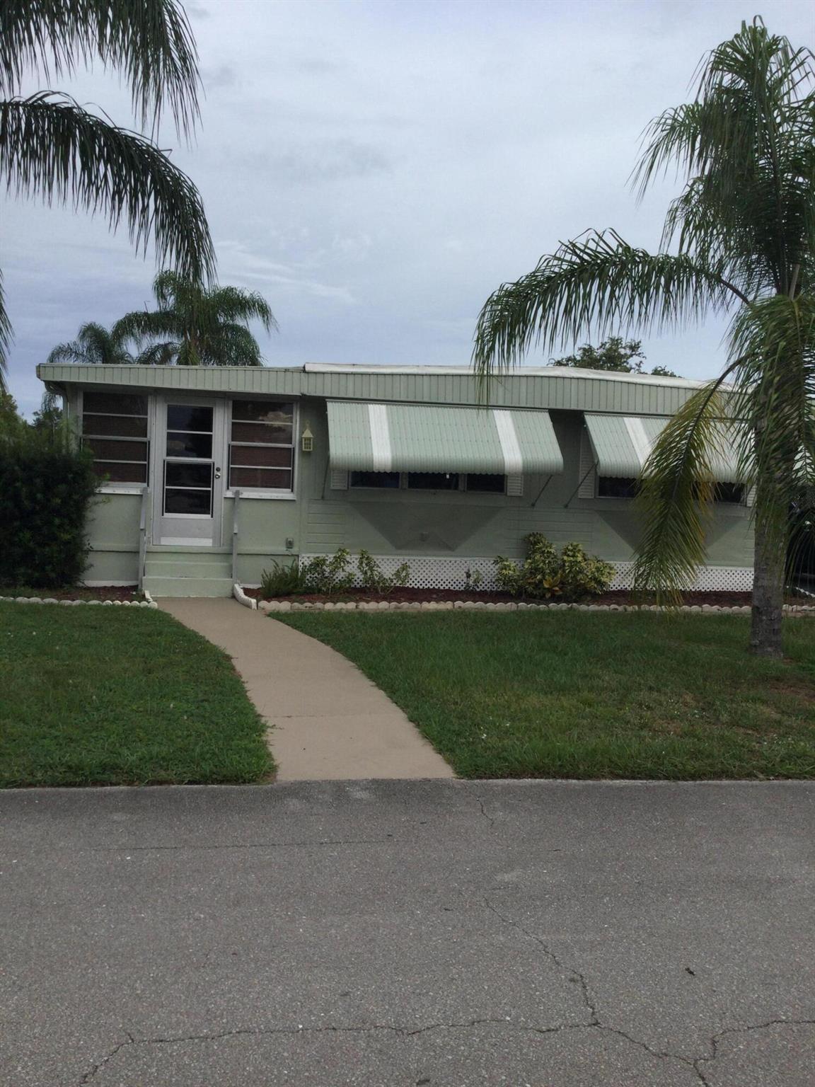 This meticulously maintained and rare three bedroom, with office, home is situated on a well maintained lot and awaits your own personal touch. Lot rent covers all amenities, taxes, lawn care and trash removal. Amenities include golf, two pools (one heated), tennis, pickleball, shuffleboard, bocce, horse shoes, billiards, game room, library, exercise room, party room, clubhouse and much much more. Join a club, sign up for a trip or just relax by the pool. Future residents must be approved by Spanish Lakes. Please call for application.