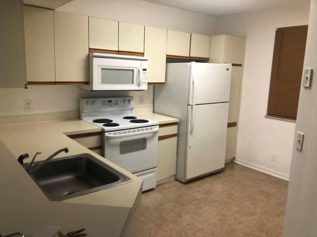 Photo of 8781 Wiles Road #201, Coral Springs, FL 33067 (MLS # B26031832)