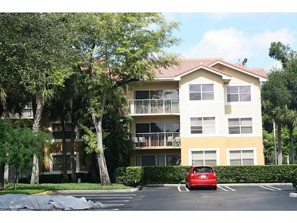 Photo of 8781 Wiles Road #201, Coral Springs, FL 33067 (MLS # B26031832)