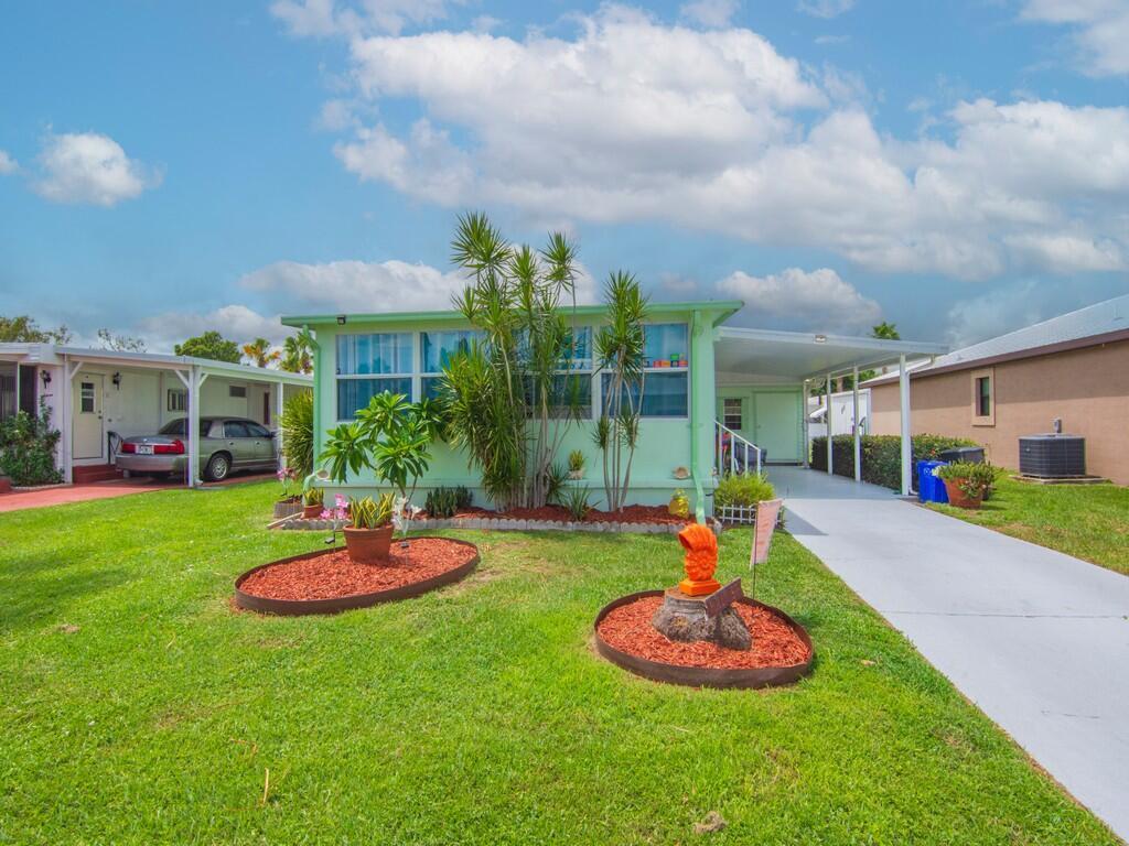 Welcome to charming 2-bedroom, 2-bathroom manufactured home nestled in the heart of the sought-after 55+ community of Spanish Lakes One. This inviting residence offers over 1000 sq ft of comfortable living space, thoughtfully upgraded with granite countertops, stainless steel kitchen appliances, and laminate flooring throughout. Recent improvements include a new vapor barrier, new tie-downs, fresh lattice skirting, and a 15-year roof sealant, ensuring peace of mind and long-term durability. The spacious living room and Florida room provide ample space for relaxing or entertaining. Enjoy resort-style amenities just steps from your door--swimming pool, golf course, tennis courts, pickleball, bocce ball, clubhouse, and more. Lot rent is $800 per month and includes lawn maintenance.
