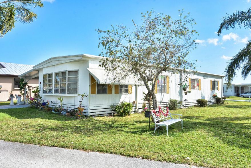 This immaculate home was completely painted inside last year.  Prego floors throughout except guest bedroom and bamboo flooring in the primary bedroom.   The home has a nautical design and is a pleasure to see all the decorations. The air conditioner has a 3 year old condenser.  The roof was repainted 3 years ago. The community has a dock on the St Lucie river, perfect for fishing and enjoying the out of doors.  Home owners enjoy the community pool, and activities at the clubhouse.  Priced to Sell!All measurements are approximate and should be verified.
