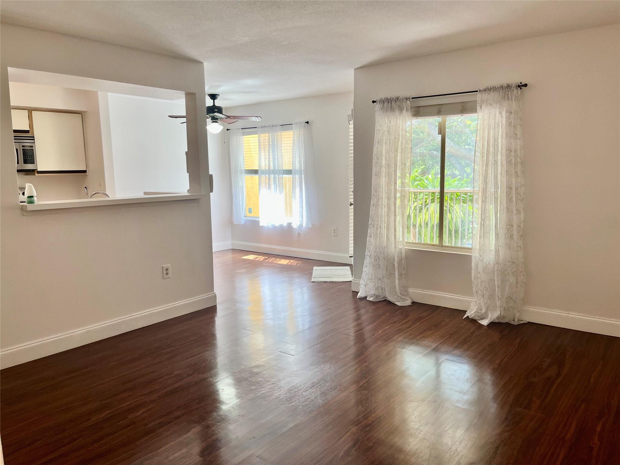 A beautiful 1/1 unit with tile and laminate wood floors throughout with stainless steel appliances. Second floor entry featuring a large screened patio with plenty of storage and full size washer and dryer. Located in a quiet, gated community in a Certified Wildlife Habitat located on 50 acres in park-like setting with a pool, hot tub, gym, new tennis/pickleball courts, lots of trees, gorgeous landscaping and plenty of parking. Prime central location close to I-95, shopping and downtown.