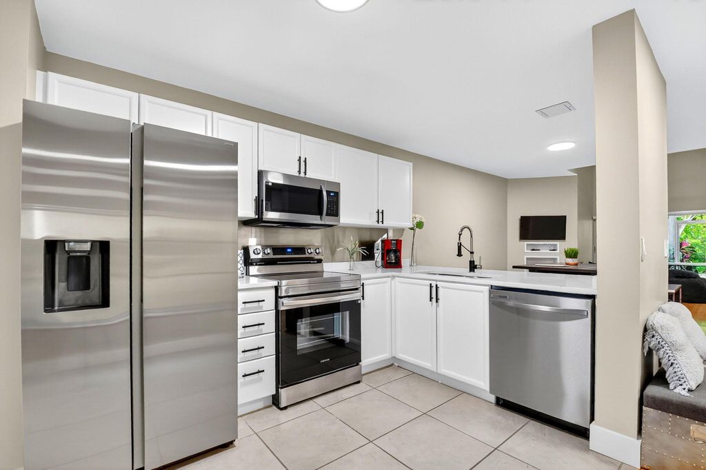 Photo of 203 Maplewood Drive, Greenacres, FL 33415 (MLS # R11131779)