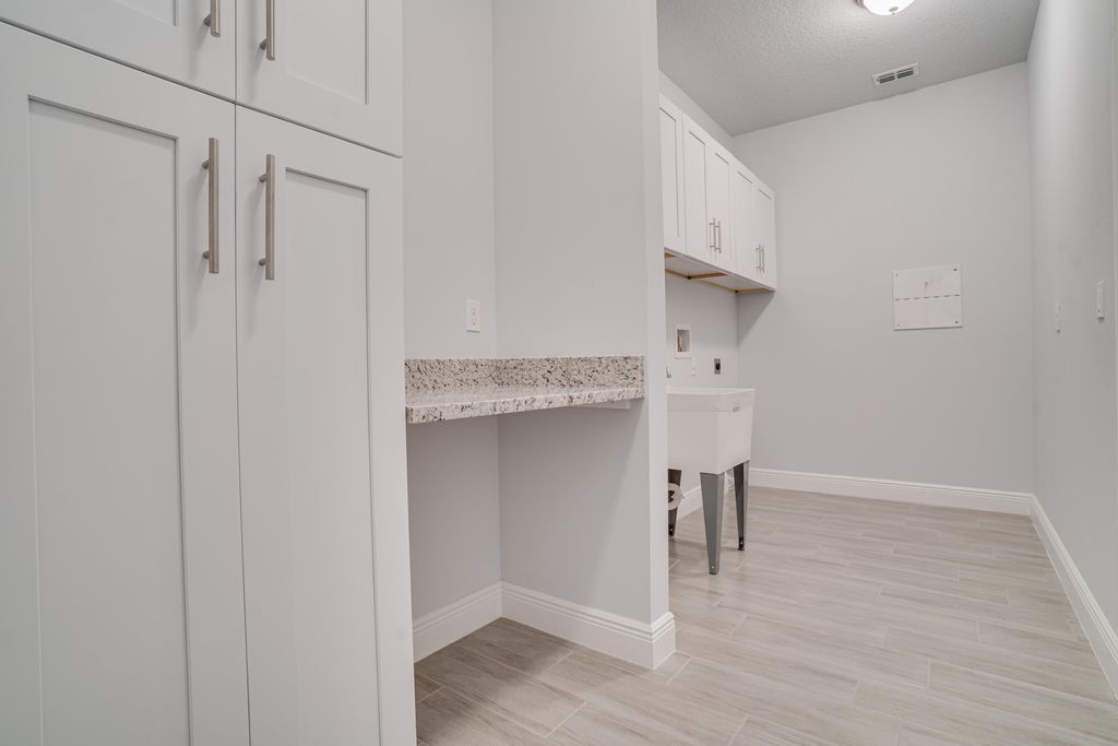 Photo of 1415 SE Bernardo Terrace, Port Saint Lucie, FL 34952 (MLS # R10938315)