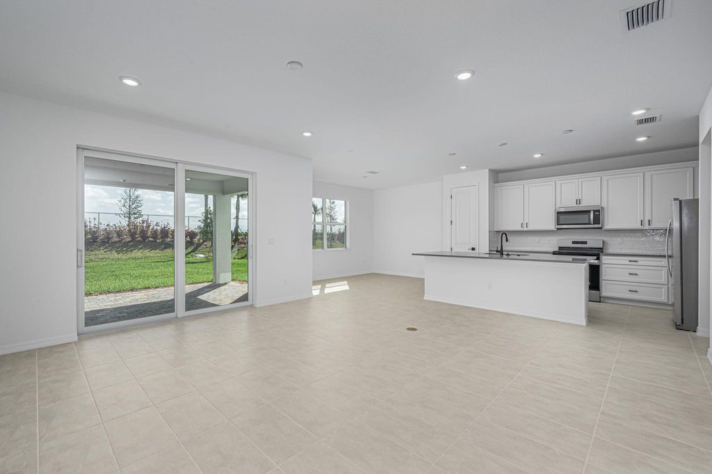 Photo of 10615 SW Morning Glory Drive, Port Saint Lucie, FL 34987 (MLS # R10990854)