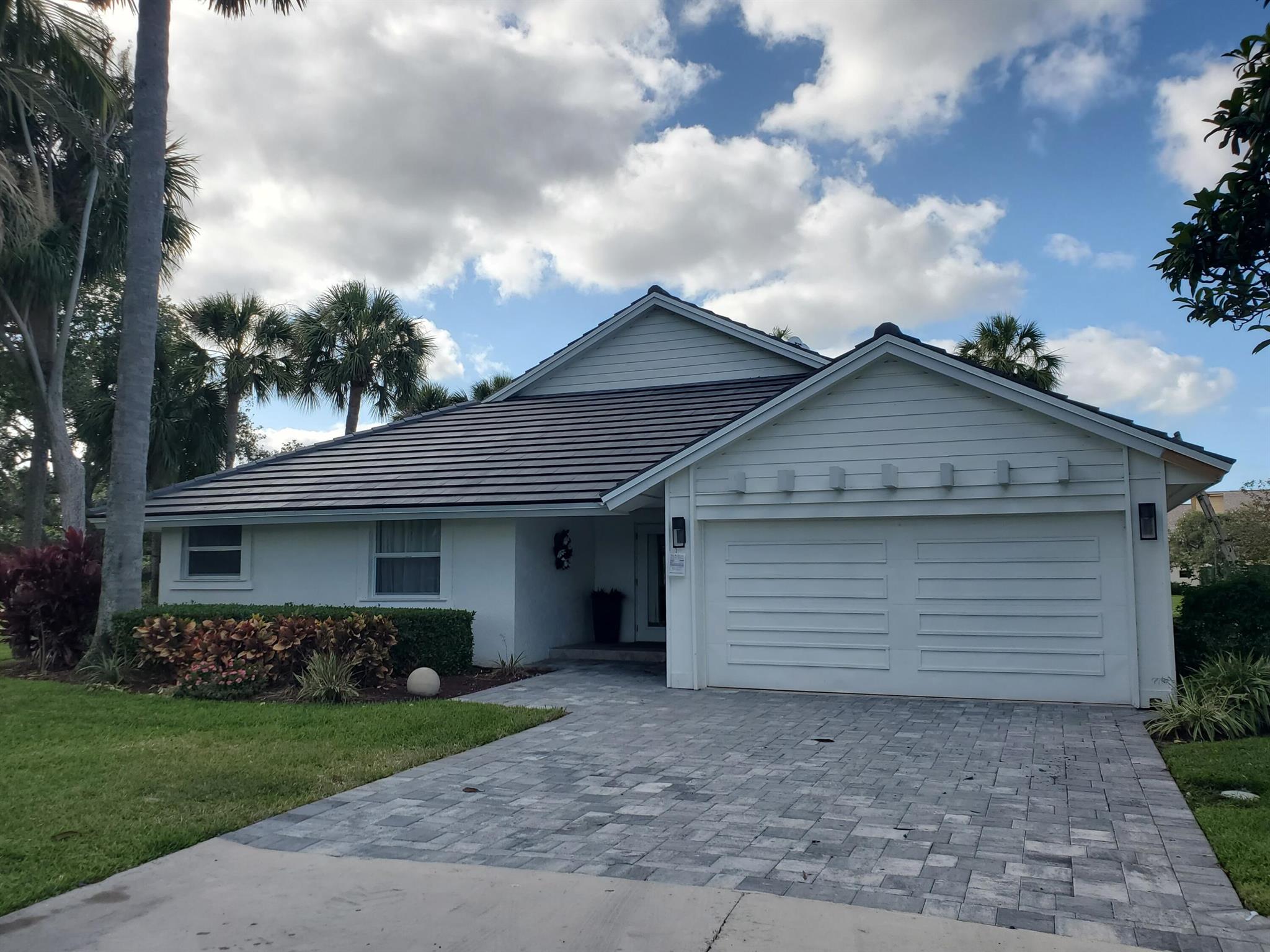Nicely updated home on corner lot property surrounded by Jonathan's Landing golf course. New roof just installed and all new impact doors and Windows installed in the past few years.