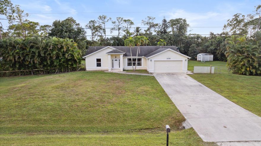 LOCATION!  LOCATION! LOCATION!  
Come see this beautiful, secluded gem that feels like heaven on earth.  Bring your boat, RV, and toys to the Acreage where there is NO HOA or restrictions!  This beautiful single-family home offers 3 bedrooms and 2 bathrooms that sits on a 1.31-acre lot.   The open floor plan creates a spacious living environment, complemented by a newly renovated kitchen (2023) with stainless steel appliances and a water fall granite countertop.  This home provides lots of space and privacy.  Escape the hustle and bustle while enjoying the enclosed private pool with an oversized pool deck area.  This is a great space for entertaining!  Do not miss out on your forever home!