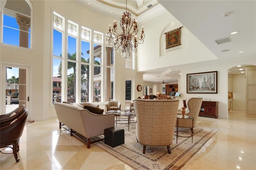 100' of water frontage in the heart of Las Olas. This awe inspiring home evokes thoughts of grandeur. This residence is truly spectacular and finished with a designer's touch. Formal dining and living rooms, family room, huge gourmet kitchen, elevator, coffered ceilings, Jerusalem stone floors, and more. All bedrooms are en-suite and have their own balconies/patios. Fabulous pool and patio area with built-in barbecue, 100' concrete dock finished with Jerusalem stone and floating dock to fit the toys