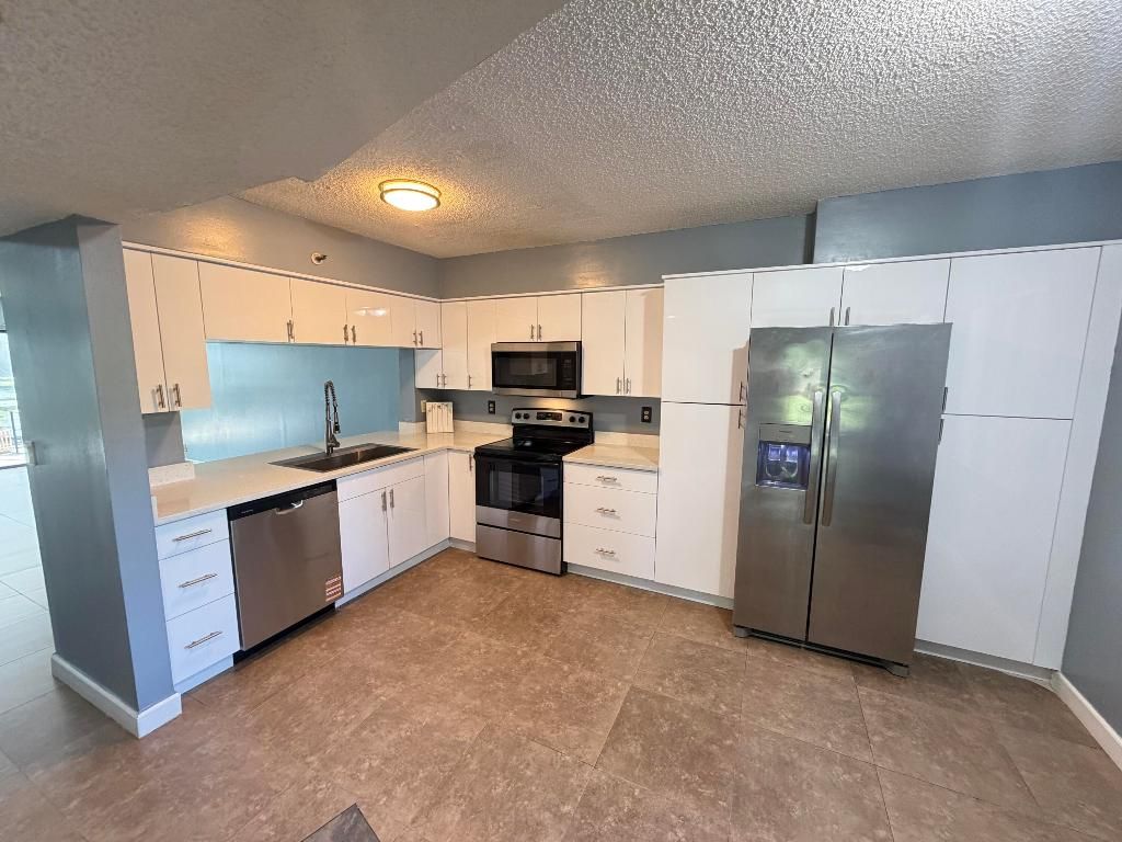 Photo of 2202 S Cypress Bend Drive #101, Pompano Beach, FL 33069 (MLS # R11146224)