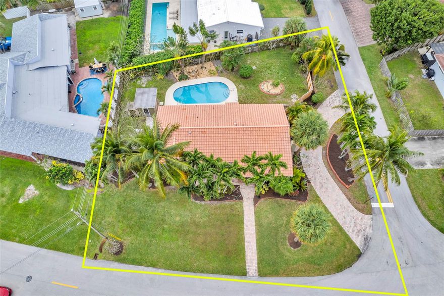 Price improvement on this giant corner properties in exclusive East Wilton Manors!  COME SEE the home & yard this weekend -- the trees are flowering! 3 bedroom, 2 bath home on 11,166-sf lot on relaxed and friendly Coral Gardens Drive.  Convenient to local restaurants, nightlife, and the beach.  The large pool with sparkling new Diamond Brite, an outdoor shower, cabana, and fountain is great for entertaining!  Expansive picture windows overlook palms and flowering plants, with tons of space to personalize with your favorite landscaping.  House is move-in ready now, or you can customize it.  Peace of mind with plumbing system relined, brand new washer and dryer, up-to-date termite warranties, and cold A/C.  Take advantage of this opportunity to create your dream home on this unique property!