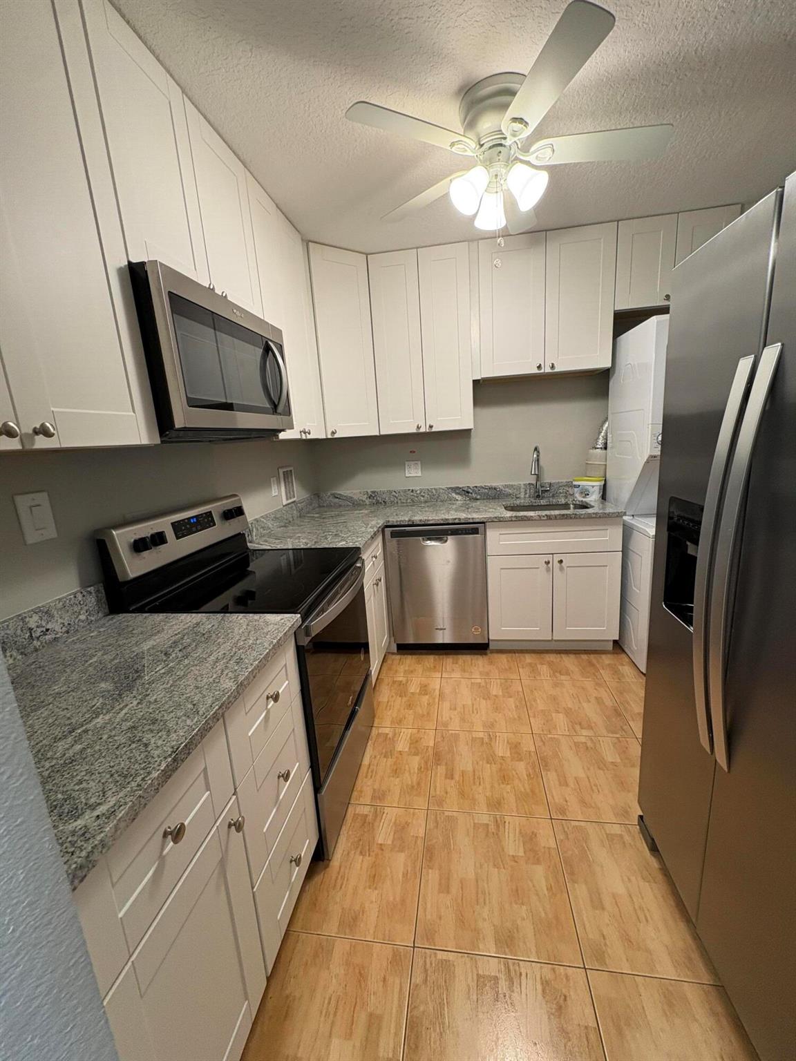Lovely 2 BD, 1.5 Baths for rent for tenants 55 years old or older.The condo is located on the first floor, very close to common patio overlooking a lake.The modern kitchen has stainless steel appliances, new cabinets, granite countertops. The 1.5 bathrooms are updated with nice ceramic tiles. There is a washer/dryer in the unit. Come and enjoy living in paradise. Century Village has many amenities to offer to residents, like over a 1000 seat clubroom to watch shows and movies, indoor and outdoor pools, medical facilities, beauty shop, tennis, boating and more. Close proximity to PBI airport, restaurants, shops and beach. Located about six miles west of Downtown West Palm Beach, Century Village Palm Beach is a gated community for active seniors.