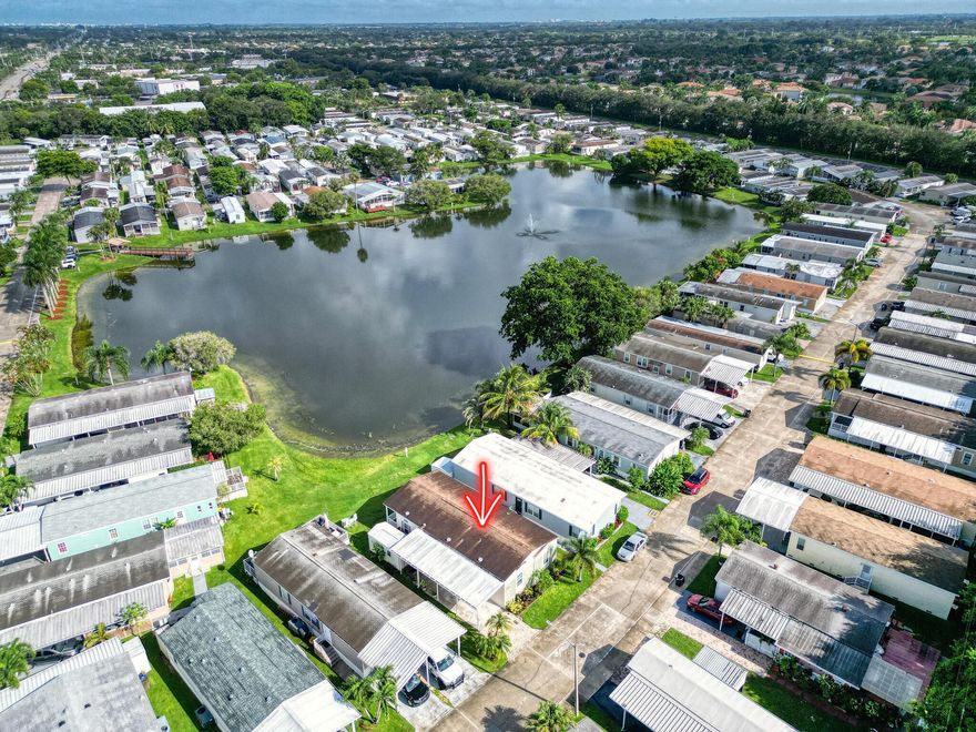 Beautifully maintained lakefront mobile home with high-end finishes throughout. Features a spacious kitchen with island upgraded bathrooms, and quality flooring. Bright interiors with large windows offering stunning lake views. Enjoy the outdoors on the large covered deck. Feels like a traditional home-move-in ready and full of charm!  SELLER FININCING AVAILABLE.