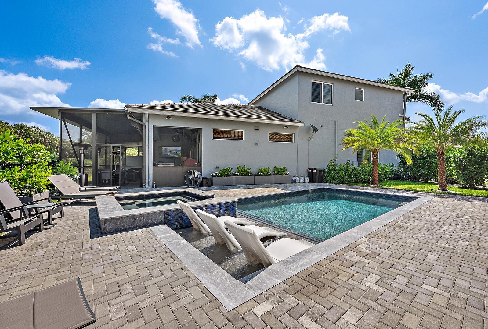 NOTHING COMPARES TO THIS STUNNINGLY AND TOTALLY REMODELED LAKEFRONT HOME WITH ALL CUSTOM AND DESIGNER FINISHES IN THIS TWO STORY HOME IN THE GRANDE SECTION OF IBIS. NOTHING IN THIS HOME WENT UNTOUCHED OR WASNT CONSIDERED. A BRAND NEW CUSTOM DESIGNED HEATED POOL AND SPA WITH A BEAUTIFUL PAVERED POOL DECK MAKE THIS A WONDERFUL HOME TO BOTH RELAX AND ENTERTAIN. BRAND NEW ROOF AND IMPACT GLASS COMPLETE THIS RESIDENCE FOR EASY FLORIDA LIVING. THE INTERIOR WAS REIMAGINED WHEN THE FAMILY ROOM WAS OPENED TO THE GOURMET KITCHEN WITH EXPANDED ISLAND AND DESIGNER CABINETRY WITH EXTRA STORAGE. BEAUTIFUL DECORATOR FINISHES AND BUILT INS THROUGHOUT INCLUDING A CUSTOM BAR AND HUMIDOR. COMFORT AND STYLE ARE EVIDENT WITH EACH BEDROOM HAVING THEIR OWN THERMOSTAT. PRIMARY WITH LOTS OF CLOSET SPACE.