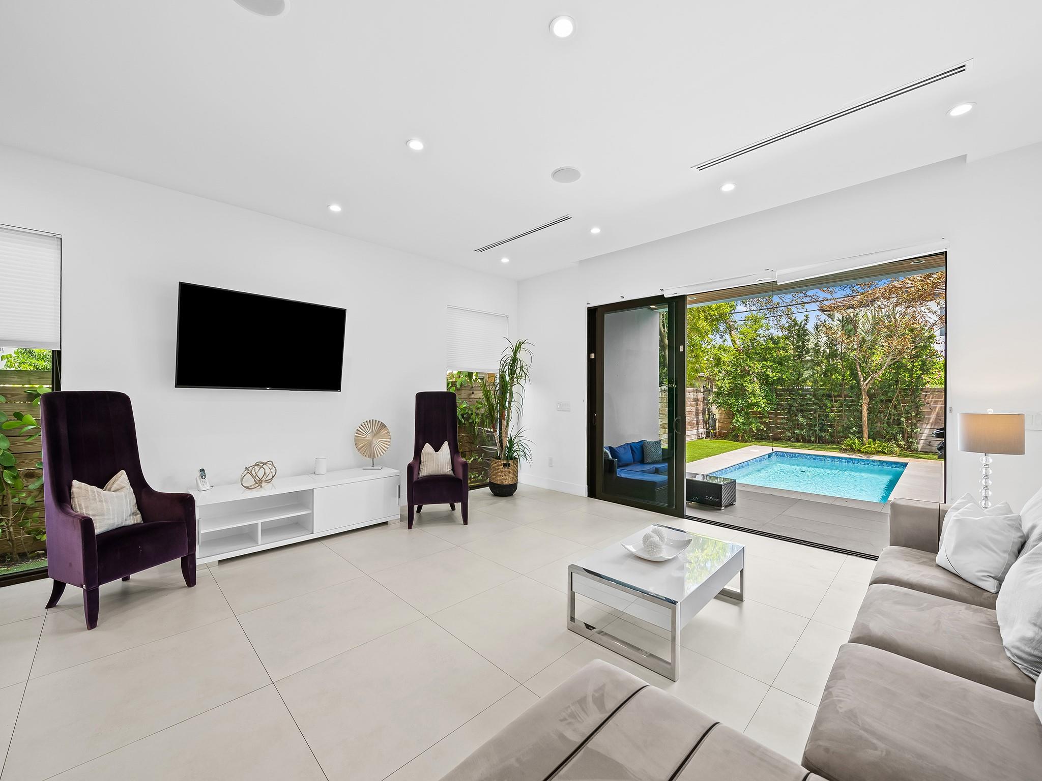 Discover the epitome of modern luxury in the heart of Ft Lauderdale prestigious Victoria Park. This newly built townhome offers elevated living w/ bright, open-concept spaces and sophisticated finishes, including tile flooring throughout. The gourmet chef’s island kitchen seamlessly connects to the dining and family areas, opening to a private outdoor oasis complete with a sparkling pool & summer kitchen. Upstairs, enjoy 3 generously sized ensuite bedrms, a versatile loft & a spacious balcony overlooking the serene pool. Ideally located just minutes from the vibrant energy of Las Olas Blvd & the pristine beaches, this residence delivers the perfect combination of style, comfort, and location whether as your personal sanctuary or a highly desirable income-producing property. SQFT from BCPA