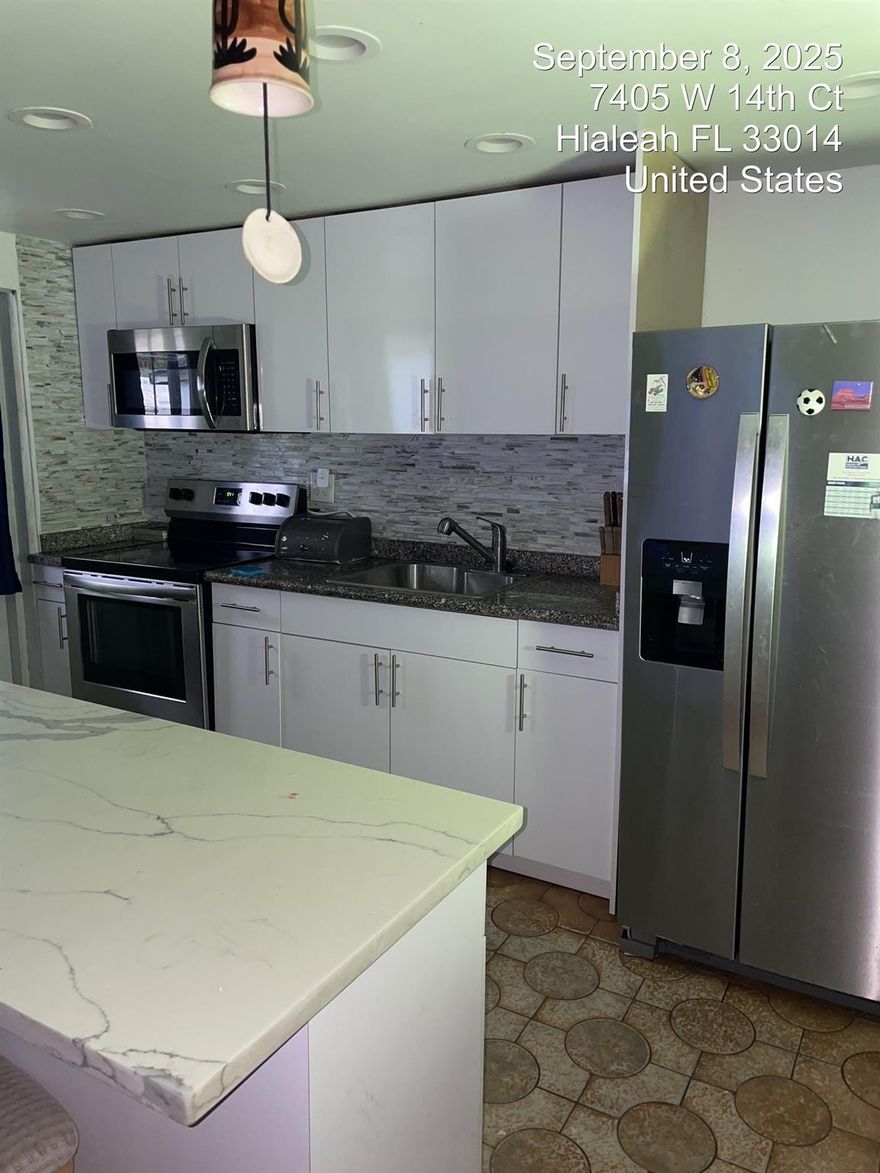 Exceptional opportunity in the heart of West Hialeah! This spacious 4-bedroom home features a highly desirable open-concept layout and a private split floor plan. The oversized back bedroom is perfectly suited for an 'In-Laws' Quarters' or a secluded guest suite. Beautiful Terrazzo and Ceramic tile floors throughout provide a clean, modern feel. Situated on a generous 7,500 sq. ft. lot with room for a pool. Extremely motivated seller—bring all offers!"
