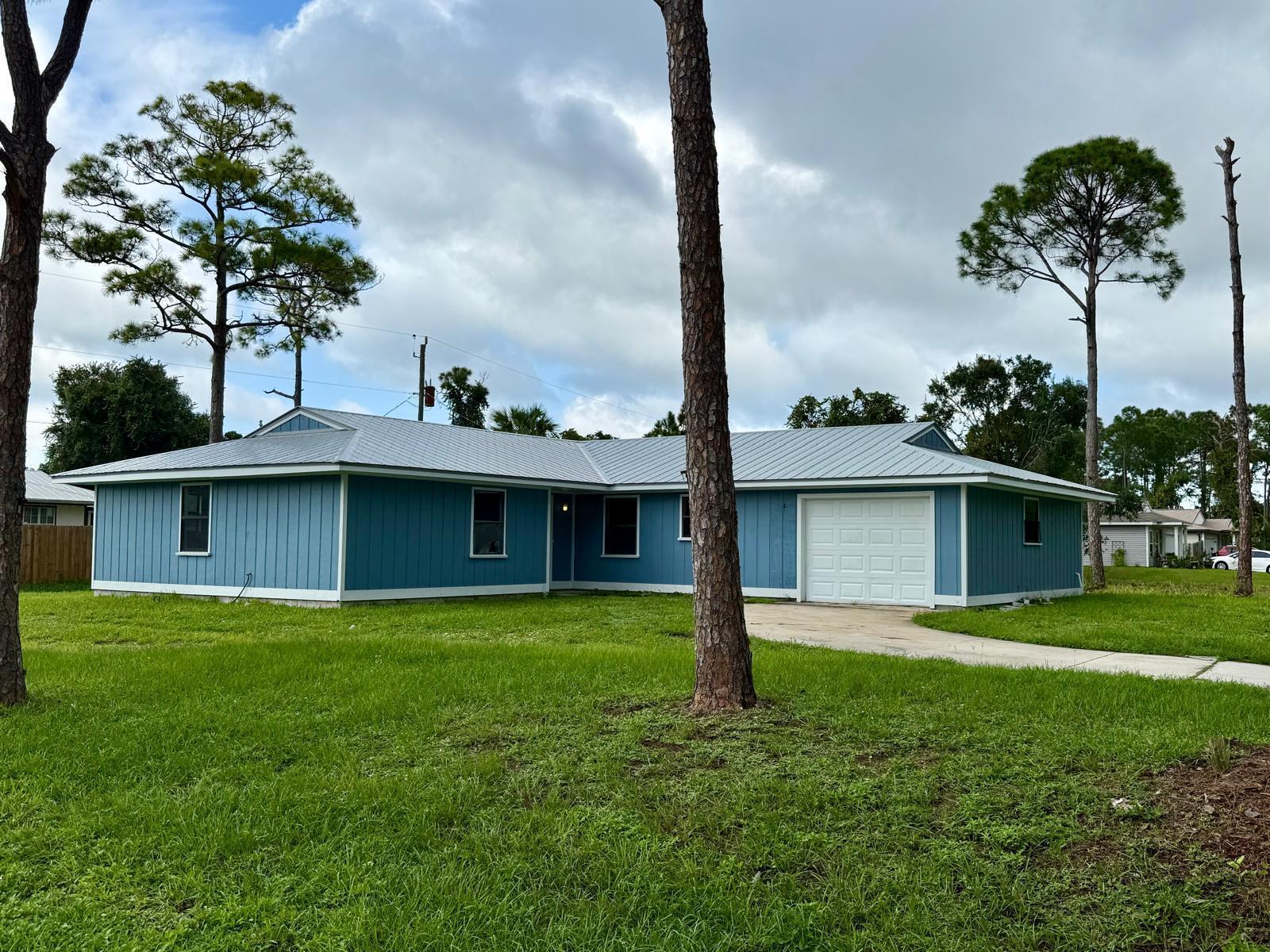 Discover the potential in this 3-bedroom, 2-bath single-family home with a 1-car garage, perfectly situated on a desirable corner lot in Fort Pierce. Featuring a brand-new 2024 metal roof and a new A/C system, the big-ticket items are already taken care of. Inside, you'll find a spacious floor plan that's ready for your personal touch--just a little love will transform this property into the perfect place to call home.Whether you're a buyer looking to customize your dream home or an investor searching for a fantastic opportunity, this property is priced right for a quick sale. Don't miss your chance to add value and enjoy the benefits of ownership in a growing area.