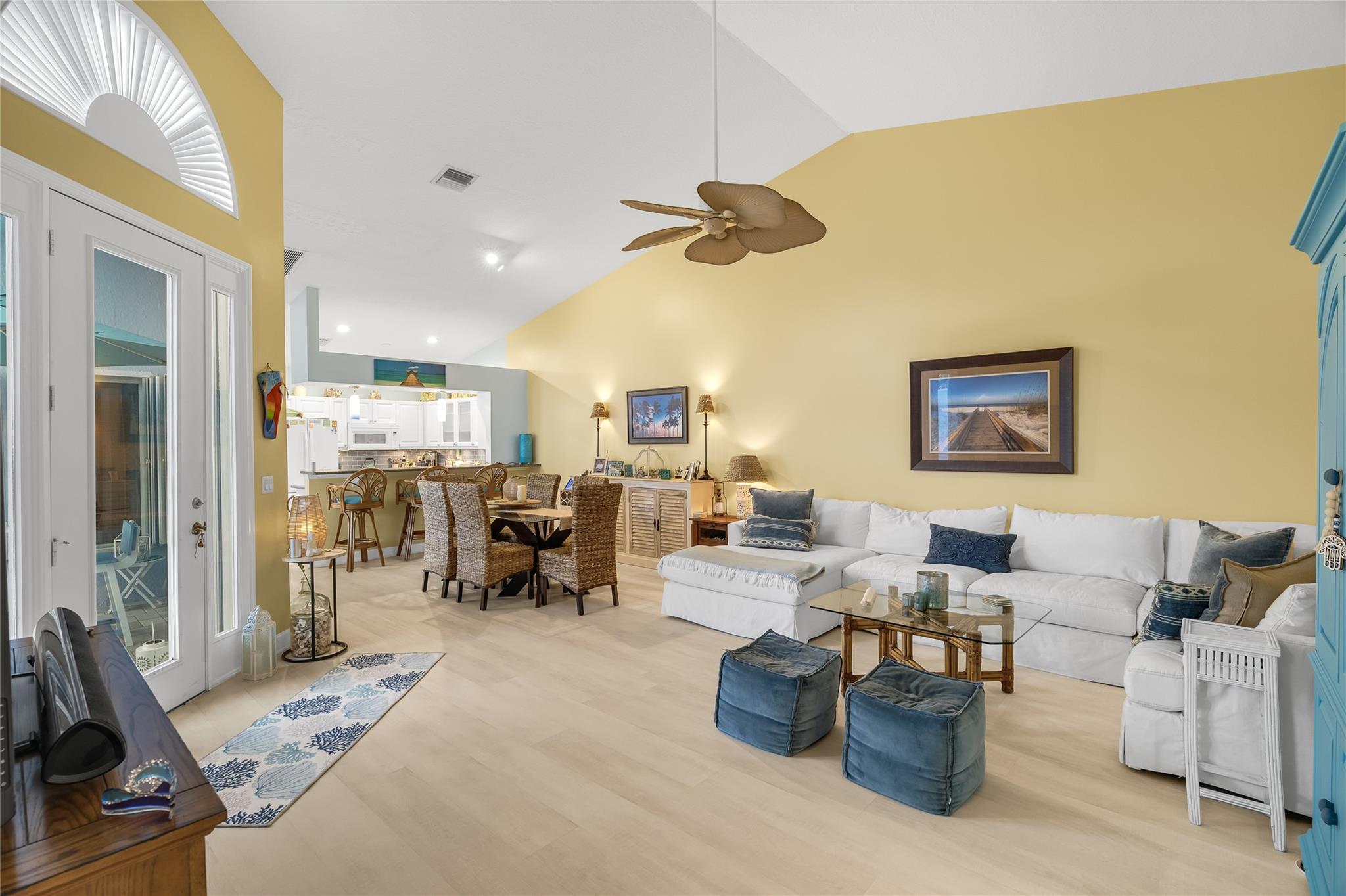 Embrace the Florida lifestyle in this bright 3 bed, 2 bath beachside retreat with private pool! Just a short distance from the beach with private access, this coastal inspired home is full of cheerful design touches, from the whitewashed wood look laminate flooring to the fresh, vibrant wall colors, and white cabinetry with a decorative blue tile backsplash.
The outdoor area includes newly refreshed screened pool and patio, ideal for outdoor dining or relaxation. An outdoor shower is convenient for the beach. Additional features include a 2-car garage, laundry sink in the garage, 2021 roof, and accordion hurricane shutters. Whether you're looking for a full-time residence or seasonal getaway, this home checks all the boxes with its stylish updates and unbeatable location.