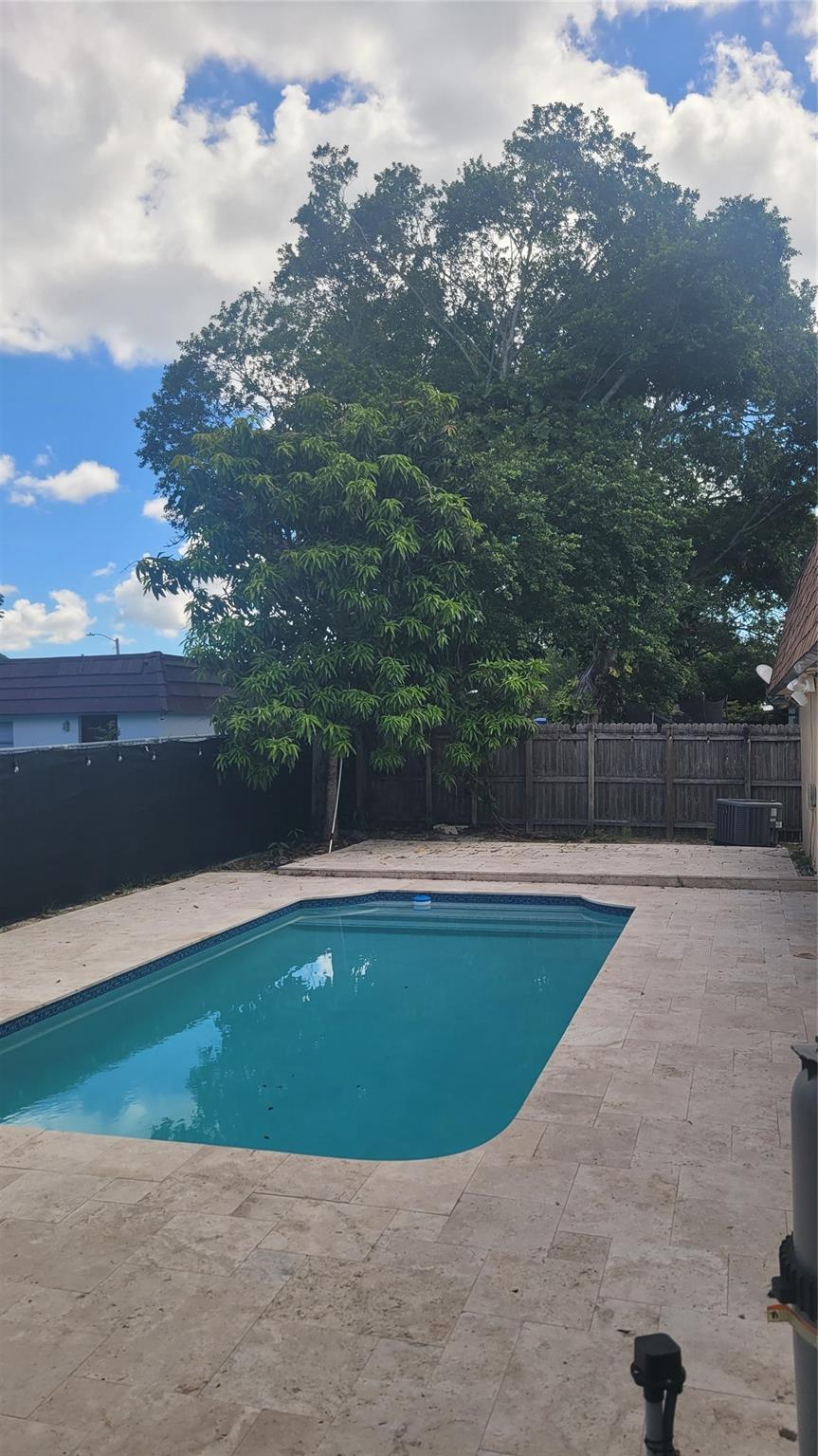 Spacious 2/2 with family room that can be used as 3rd room or office. Enjoy newly renovated kitchen bathroom with great garden and pool view. Brand new roof and accordion shutters for no stress during hurricane season. Plenty of parking and conveniently located in walking distance to nearby hospital, place of worship, shops, restaurants and public transportation on University Drive....NO ASSOCIATION!