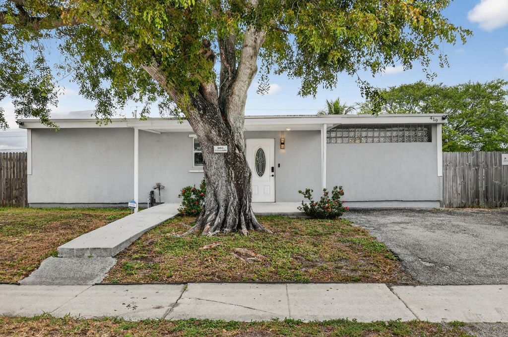 Photo of 419 Cheyenne Drive, Lake Worth, FL 33462 (MLS # R11160458)