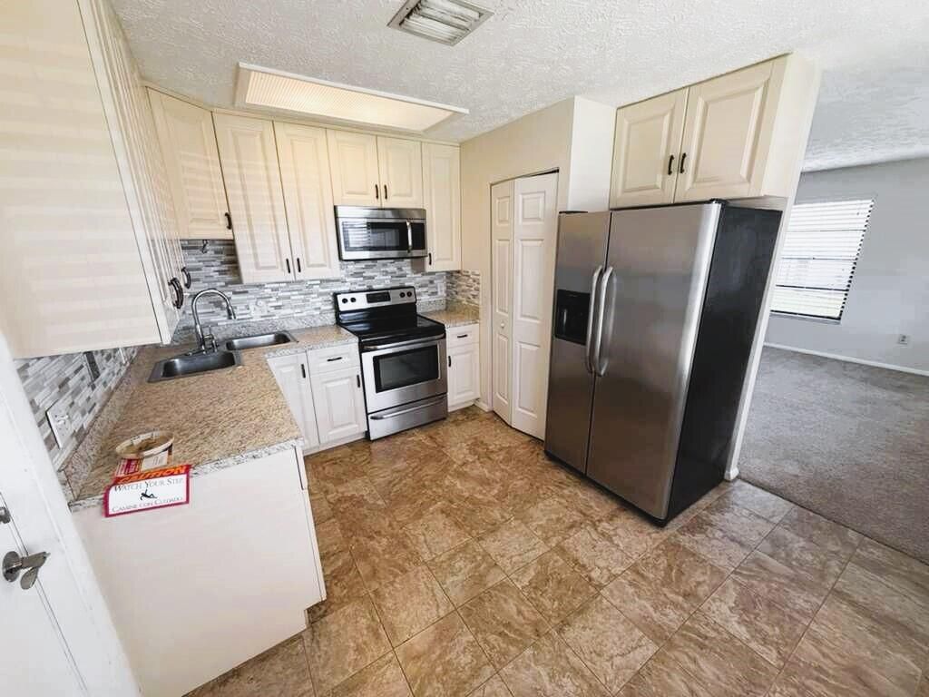 Photo of 2055 SW Cranberry Street, Port Saint Lucie, FL 34953 (MLS # B26007364)
